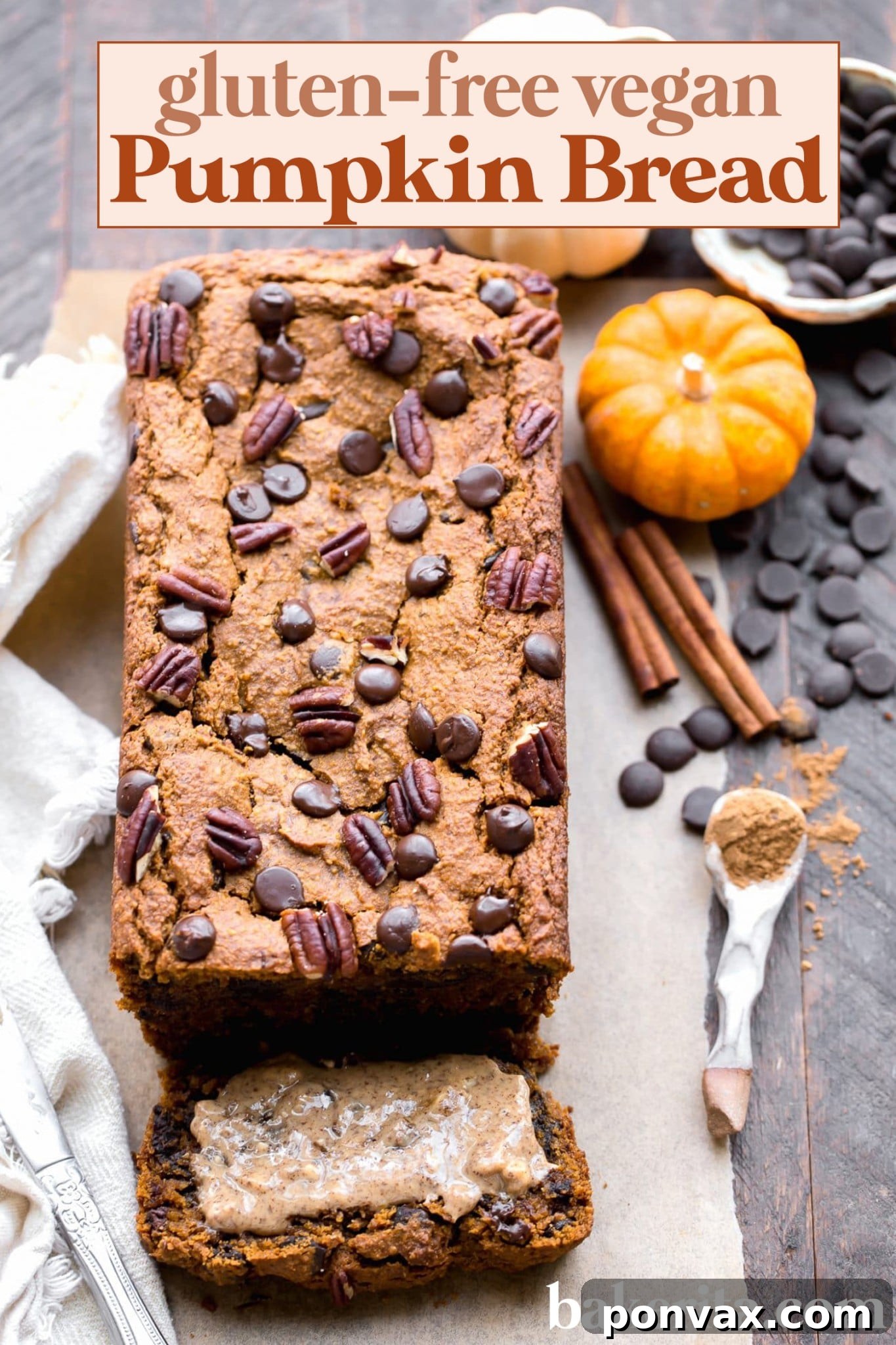 Beautifully presented slices of Chocolate Chip Vegan Pumpkin Bread on a cutting board, garnished with a few whole chocolate chips, highlighting its simple elegance and deliciousness.