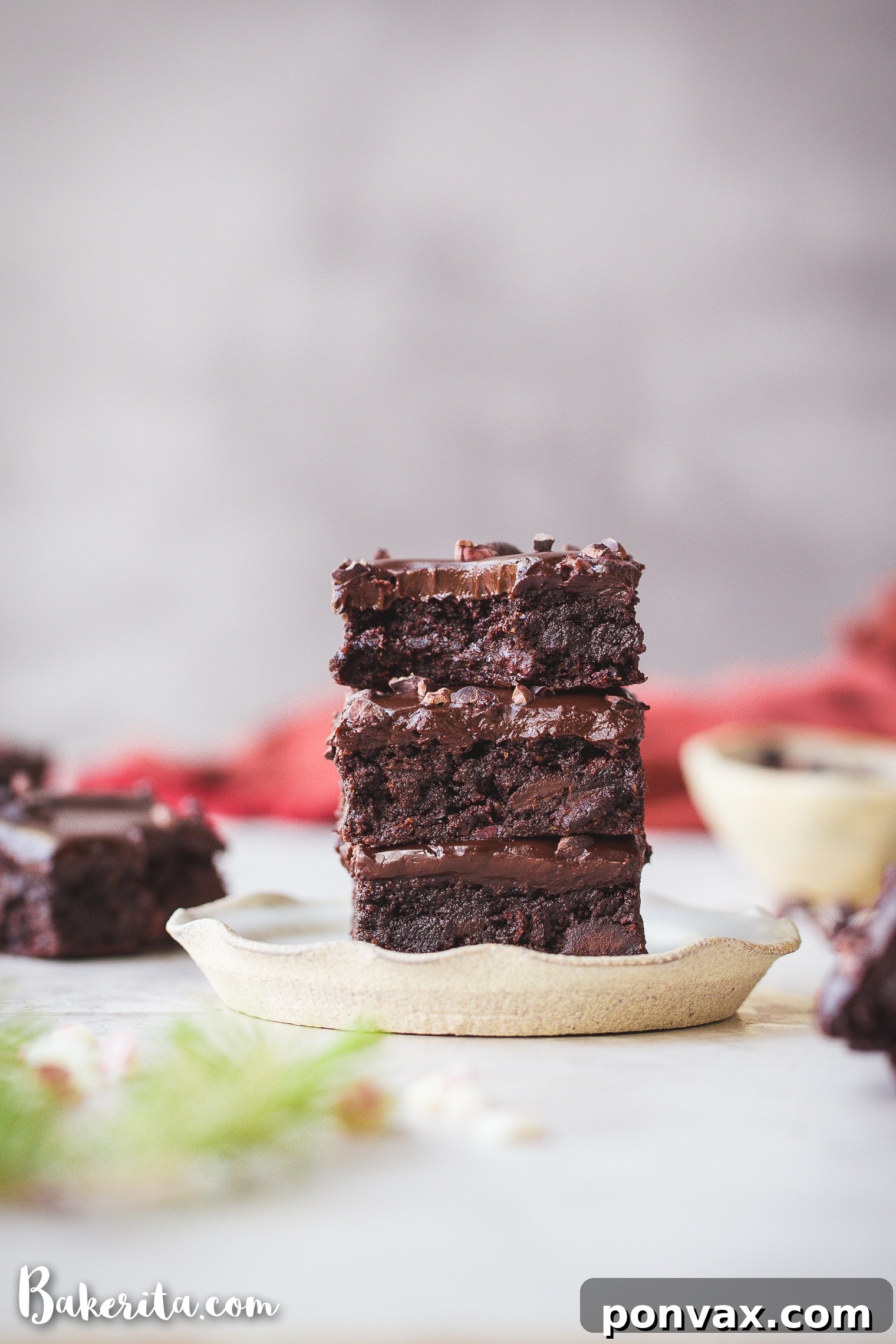 Rich and fudgy gluten-free peppermint brownies topped with dark chocolate ganache and cacao nibs.