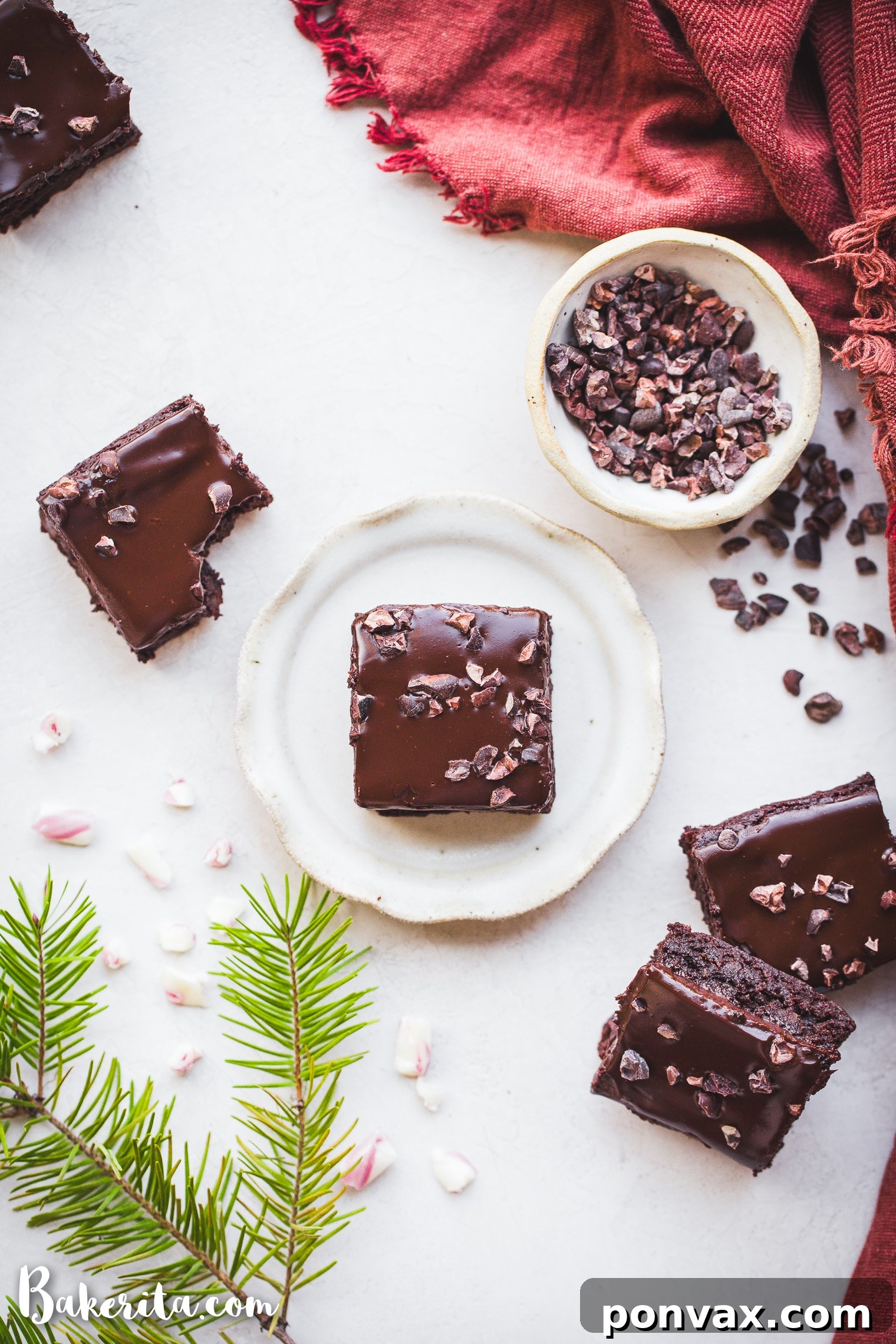 A slice of gluten-free peppermint brownie with ganache, ready to be enjoyed.