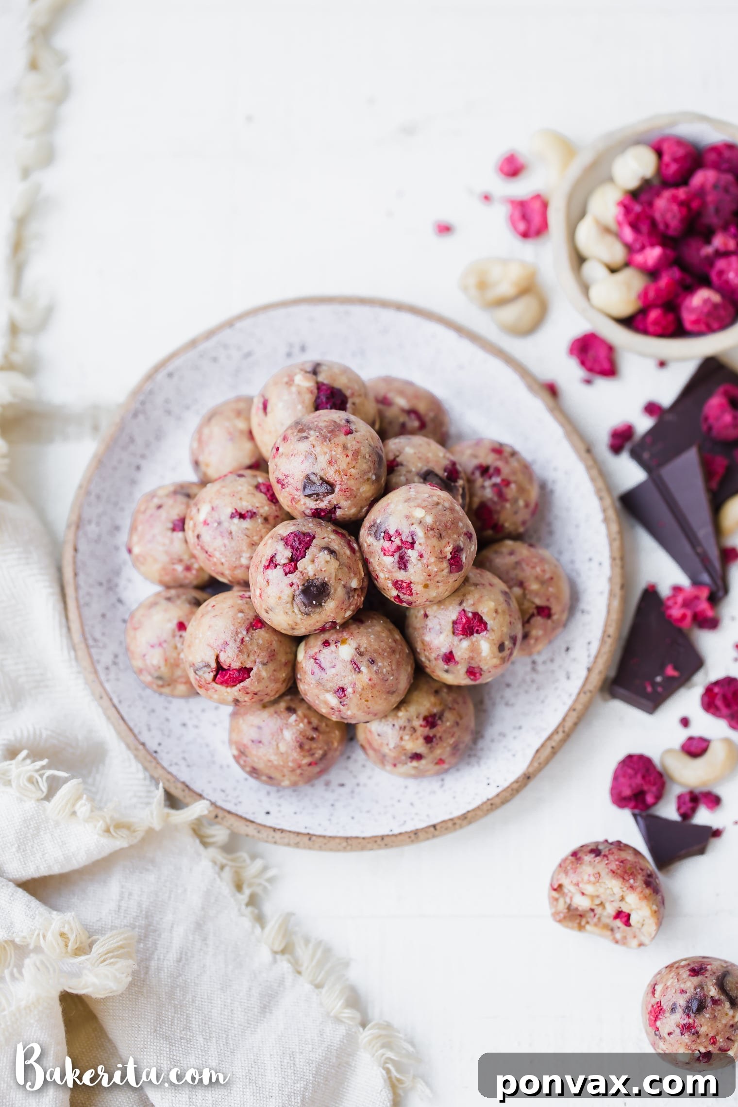 Raspberry Dark Chocolate Power Bites Gluten Free Paleo Vegan 2 Freshly prepared Raspberry Dark Chocolate Energy Bites artfully arranged on a serving plate.