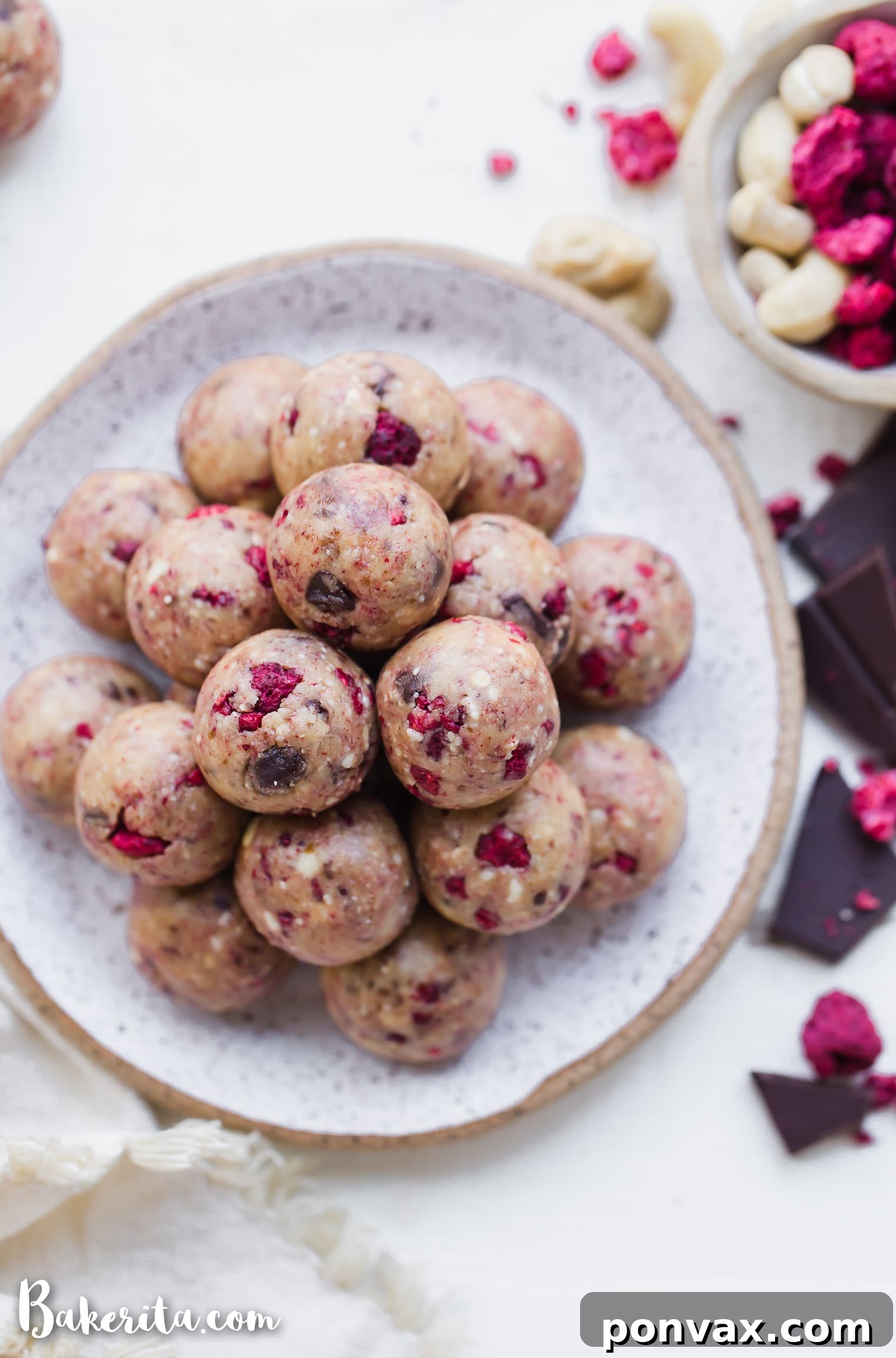 Raspberry Dark Chocolate Power Bites Gluten Free Paleo Vegan 4 An array of homemade Raspberry Dark Chocolate Energy Bites, showcasing the natural beauty of the ingredients.
