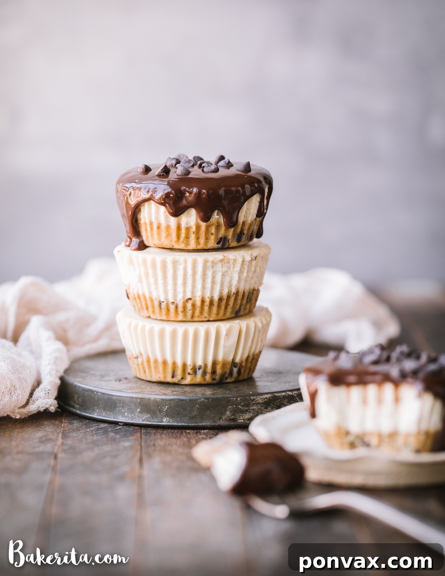 A tray of mini cheesecakes showing the thick cookie dough crust layer at the bottom.