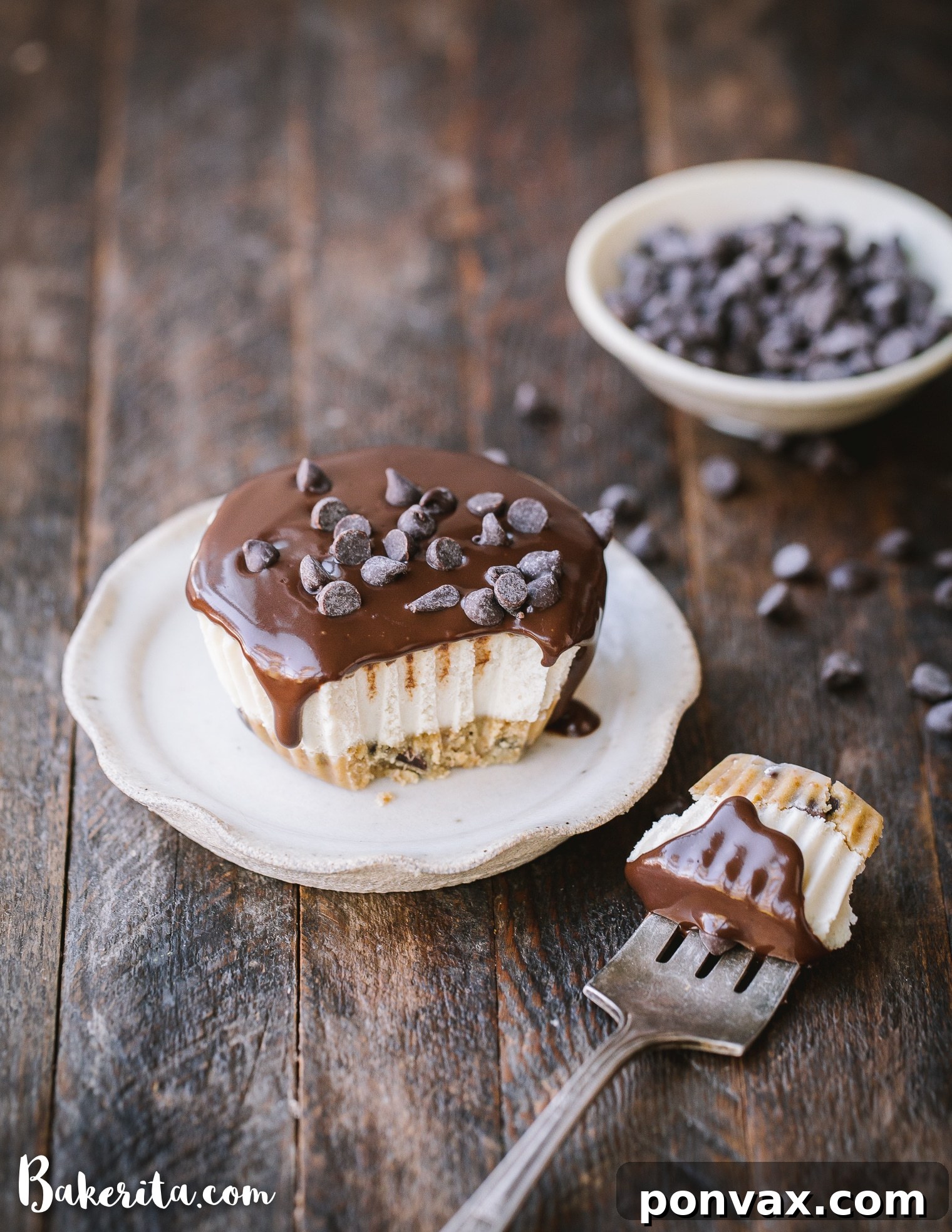 A delicious No-Bake Vegan Chocolate Chip Cookie Dough Cheesecake topped with melted dark chocolate ganache and mini chocolate chips.