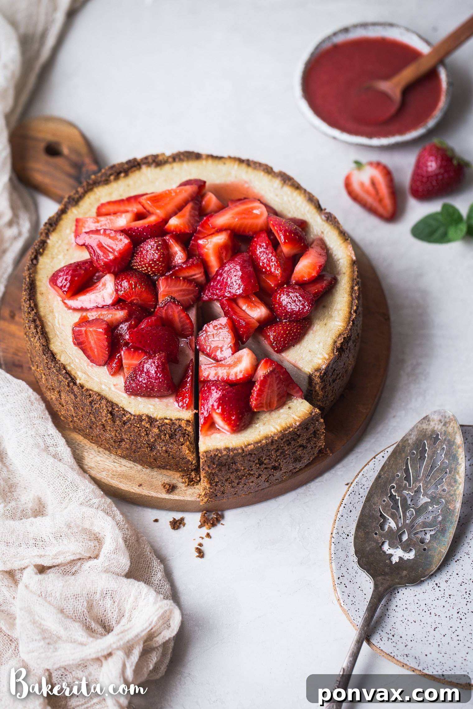 Decadent Baked Vegan Cheesecake Gluten Free 4 A vibrant close-up of the Baked Vegan Cheesecake, showcasing its creamy vanilla filling and robust gluten-free crust, ready to be topped with fresh fruit.