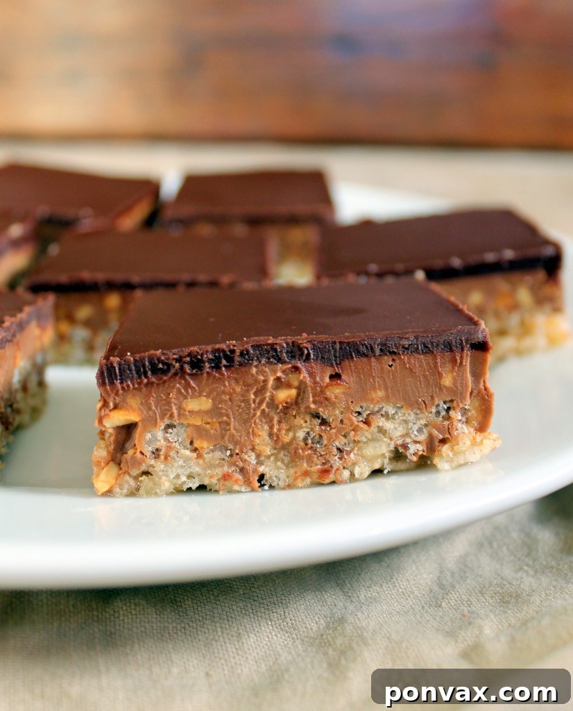 Chocolate Peanut Butter Crispy Bars | Irresistible No-Bake Treat Delicious Chocolate Peanut Butter Crispy Bars with layers of chocolate, peanut butter, and rice krispies.