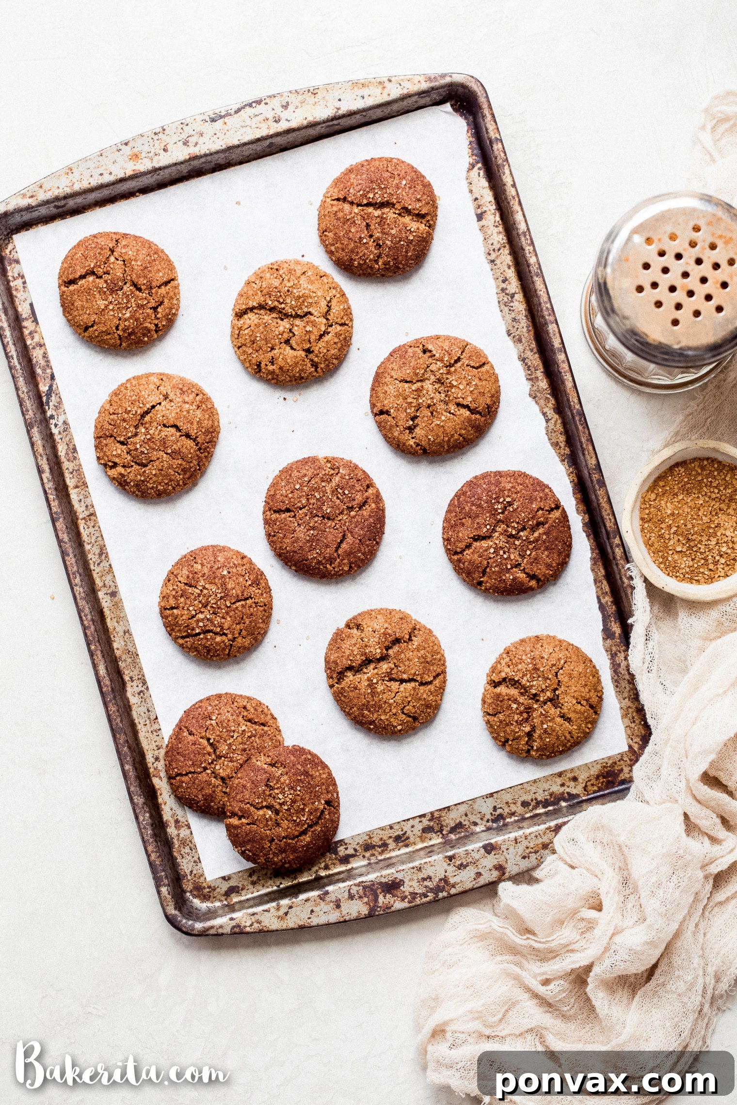 Stacked gluten-free vegan snickerdoodles showcasing their soft texture and generous cinnamon sugar coating.