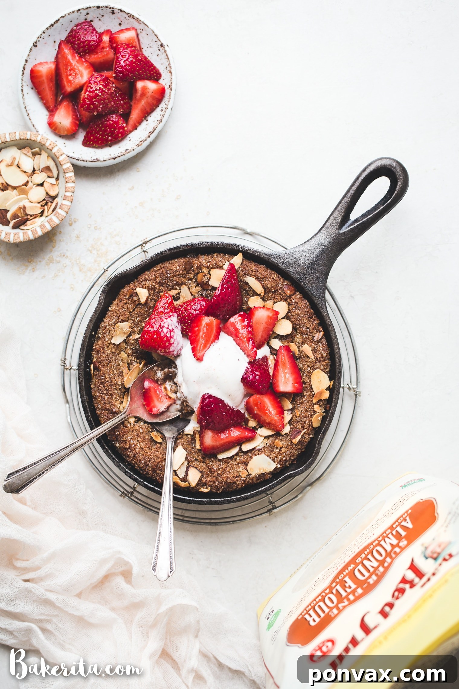 Freshly mixed Gluten-Free & Vegan Sugar Cookie Skillet dough being pressed into a cast iron skillet before baking, showcasing its texture.