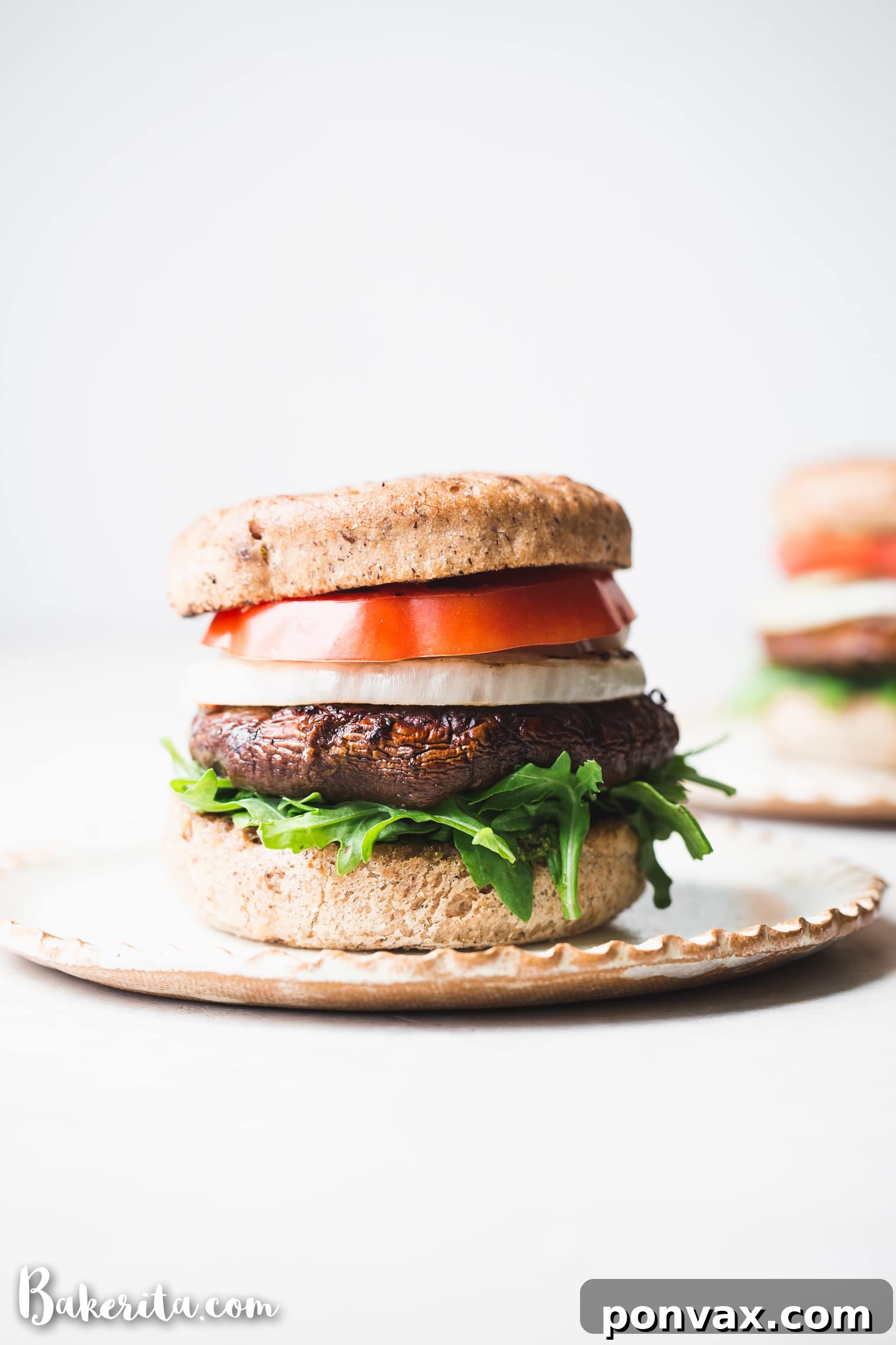 Smoky Portobello Vegan Burgers 2 Savory Vegan Grilled Portobello Burgers with Grilled Onions and Vegan Pesto