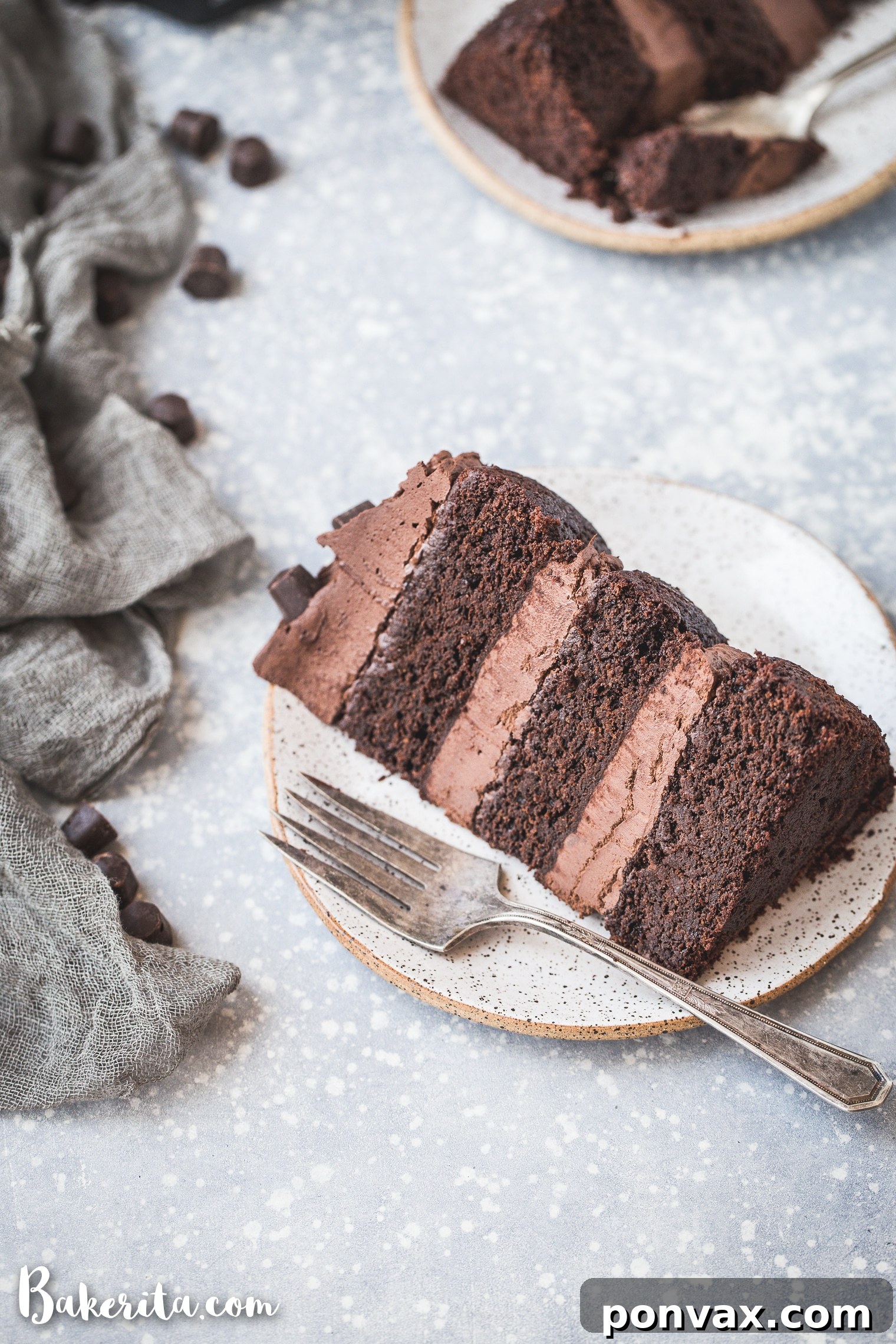 Wet ingredients for chocolate cake batter, including melted Hu Kitchen chocolate gems, dairy-free milk, and applesauce, in a mixing bowl.