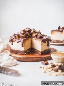 This Gluten-Free Vegan Peanut Butter Cup Cheesecake tastes like your favorite candy turned into a delightfully creamy vegan cheesecake. With a chocolate crust, creamy peanut butter filling, and chocolate ganache topping, you won't be able to have just one bite!