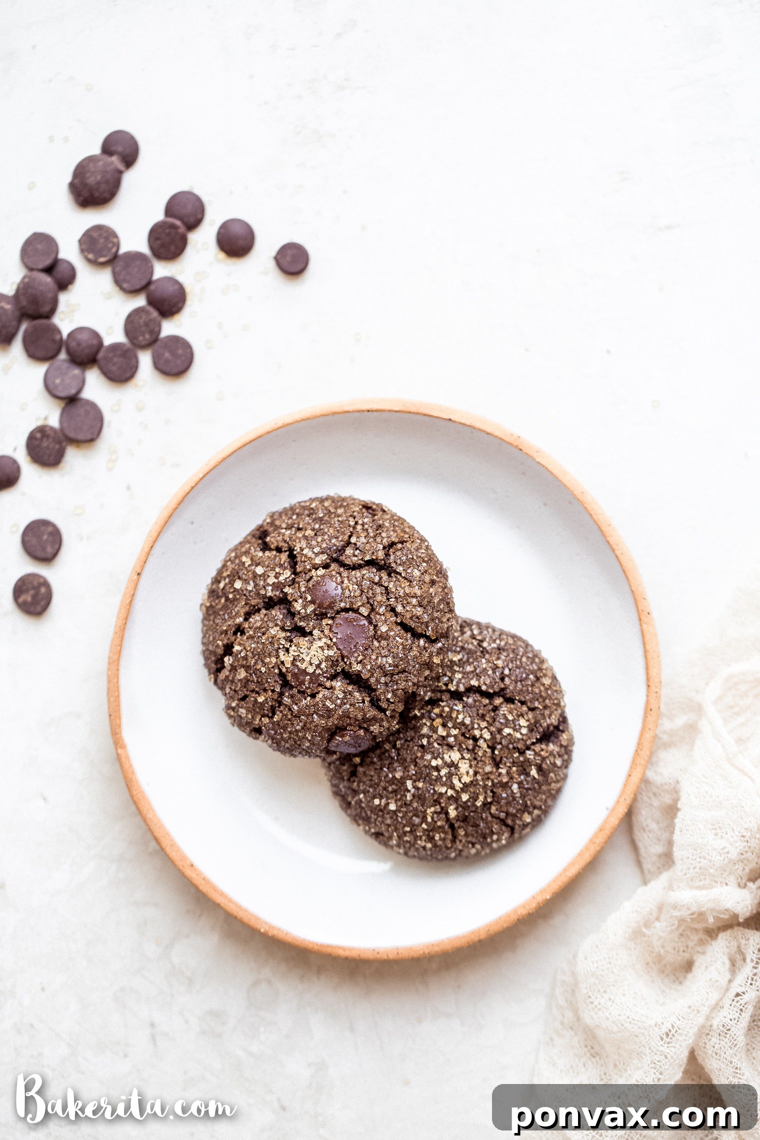 You'll find yourself wanting to double this recipe for Gluten-Free Vegan Chocolate Crinkle Cookies – one batch to share with loved ones, and another just for you! These paleo-friendly cookies are excellent for school lunches, festive moments, or even a simple dessert on a busy night, all prepared in a flash.