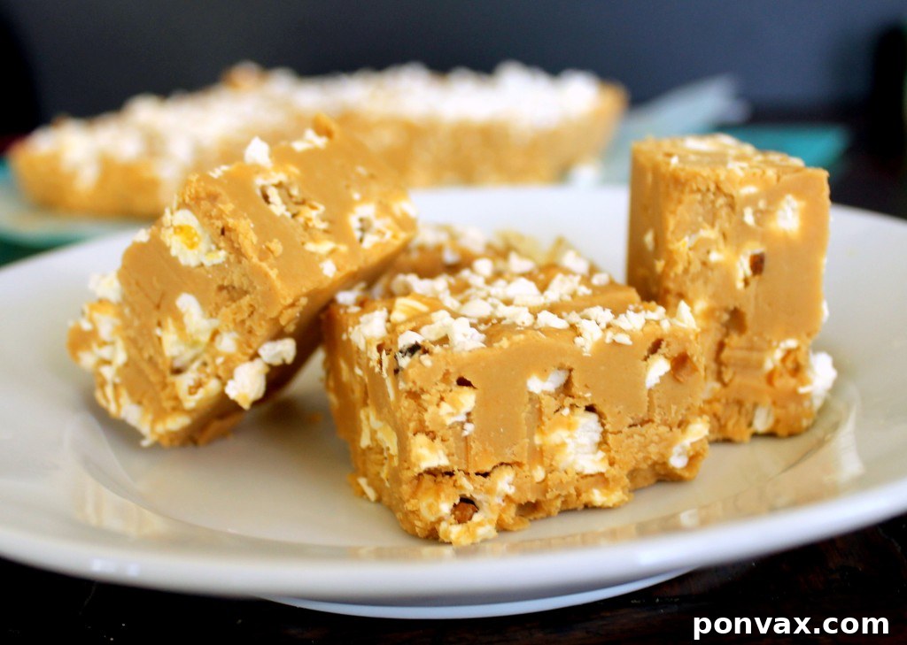 Creamy Peanut Butter Popcorn Fudge with crunchy popcorn pieces, a delightful three-ingredient dessert recipe.