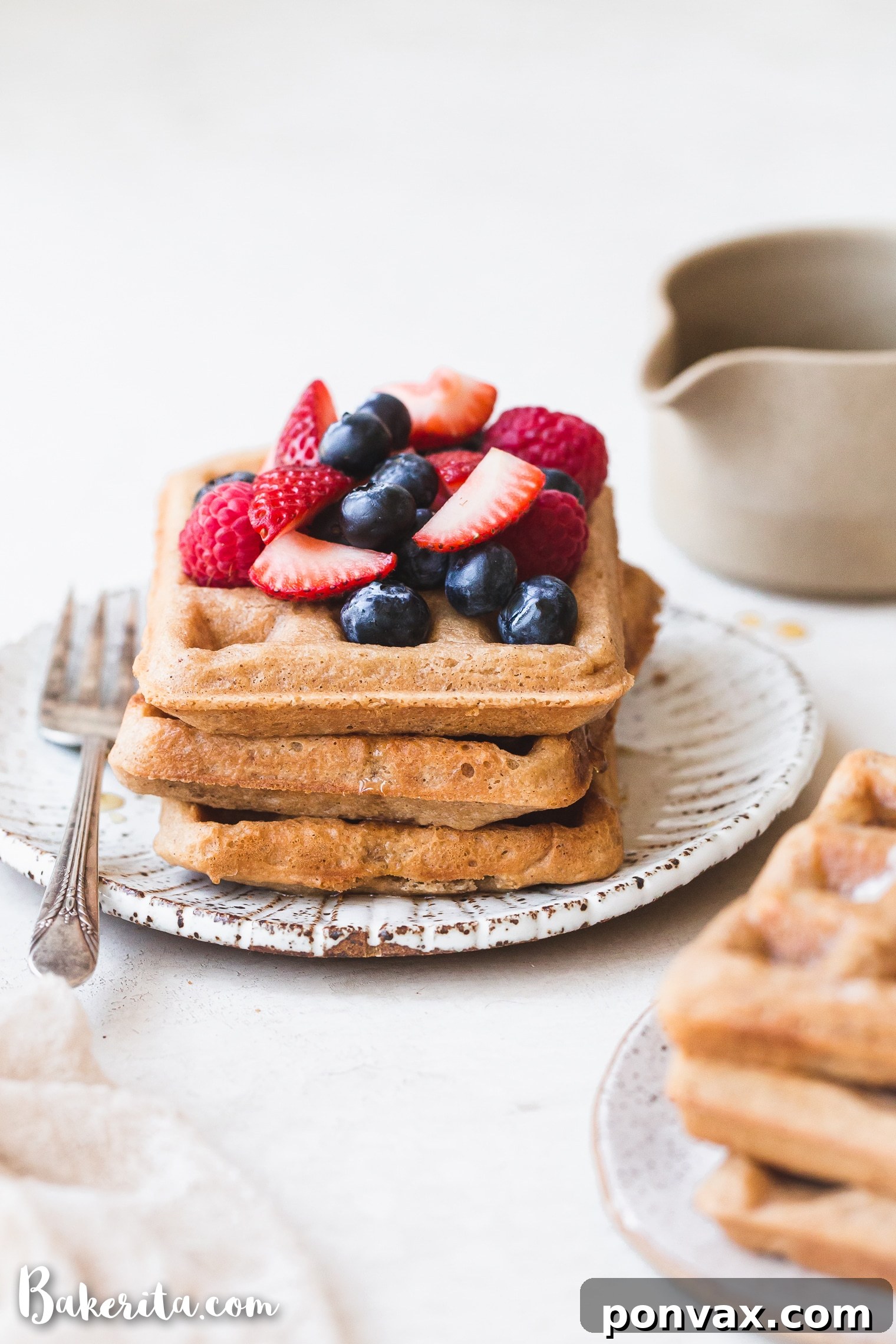 These Paleo Vegan Waffles are incredibly light, crispy, and best of all - easy to make! They're gluten-free, egg-free, and can easily be frozen for a quick breakfast.