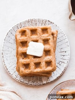 These Paleo Vegan Waffles are incredibly light, crispy, and best of all - easy to make! They're gluten-free, egg-free, and can easily be frozen for a quick breakfast.