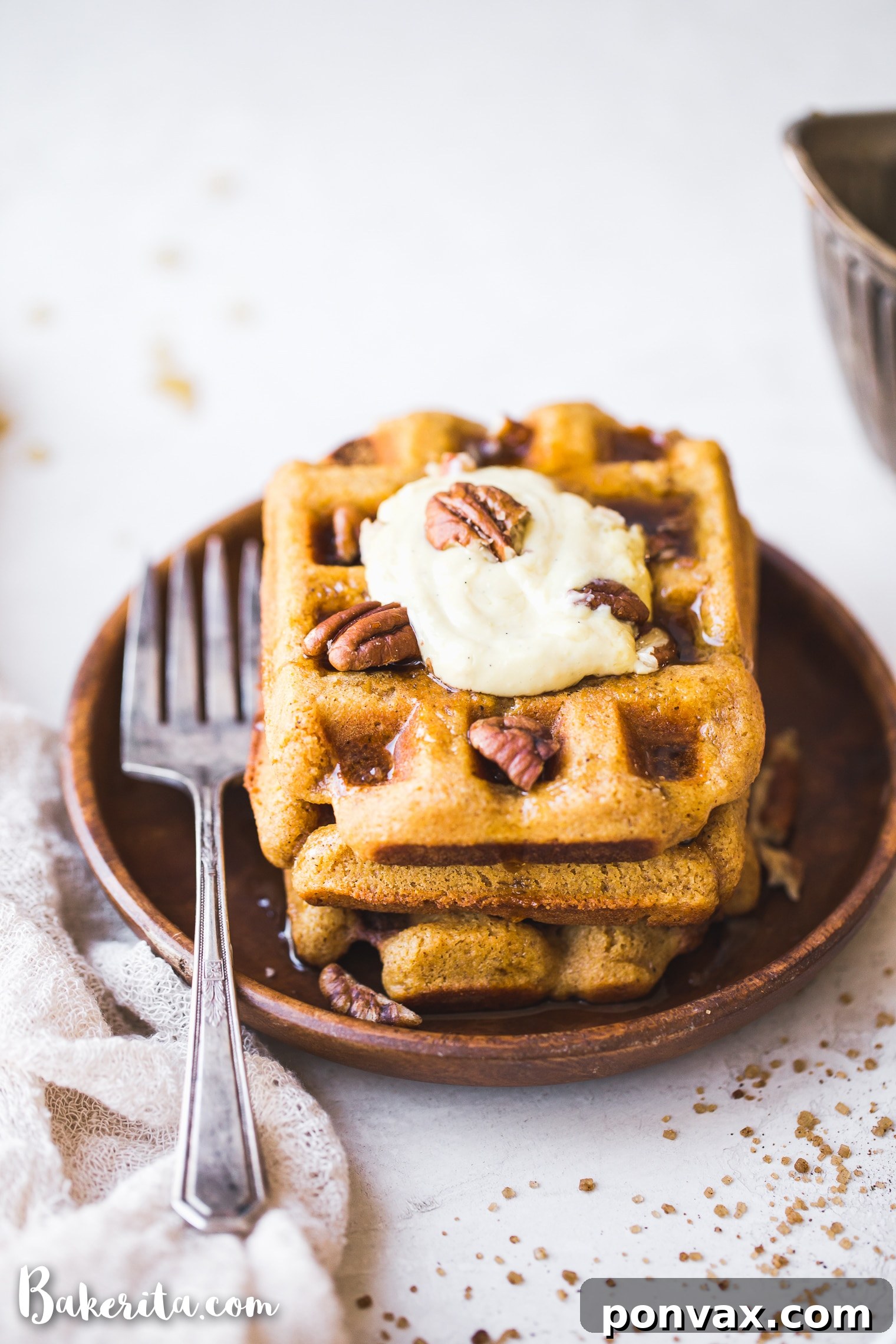 Make-Ahead Gluten-Free Vegan Pumpkin Waffles 4 A stack of warm Gluten-Free Vegan Pumpkin Waffles ready to be topped, emphasizing their golden color and inviting texture.