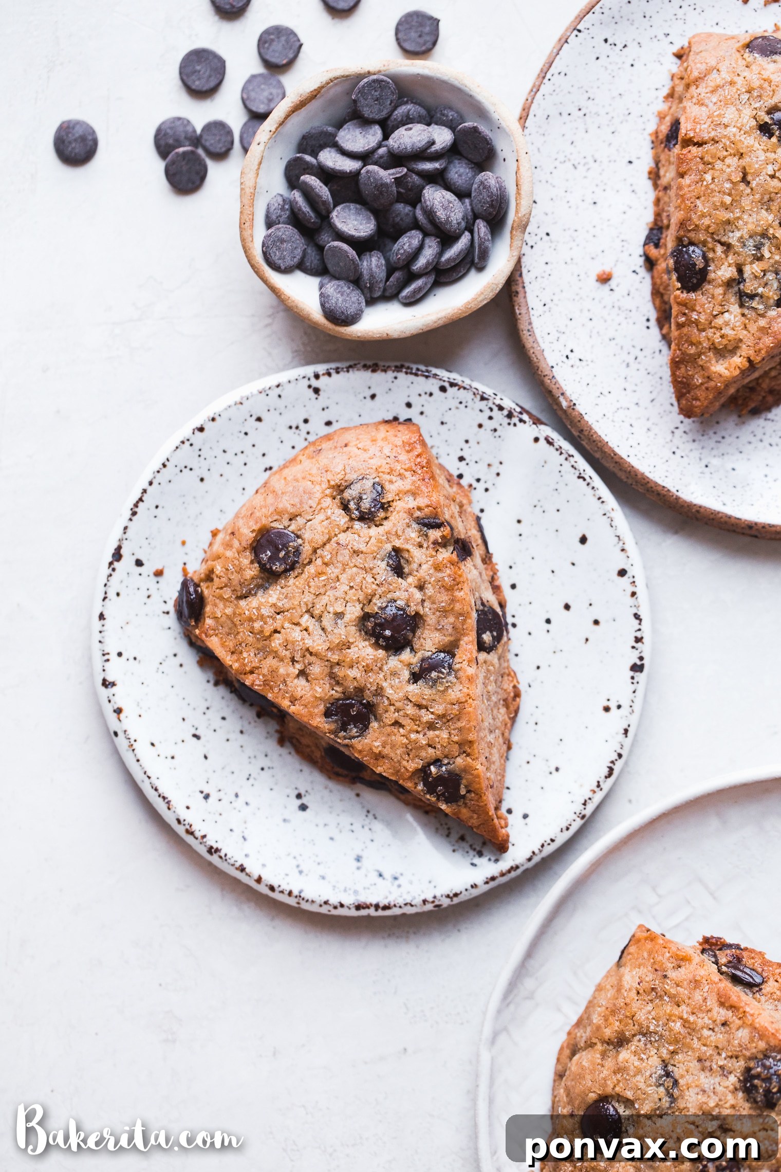 Freshly baked vegan gluten-free chocolate chip scones cooling on a wire rack.