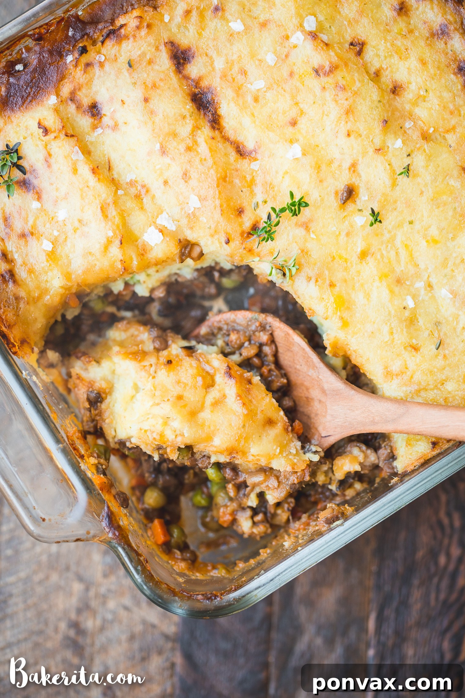 A freshly baked Vegan Shepherd's Pie in a casserole dish, topped with golden mashed potatoes and ready to be served family-style.