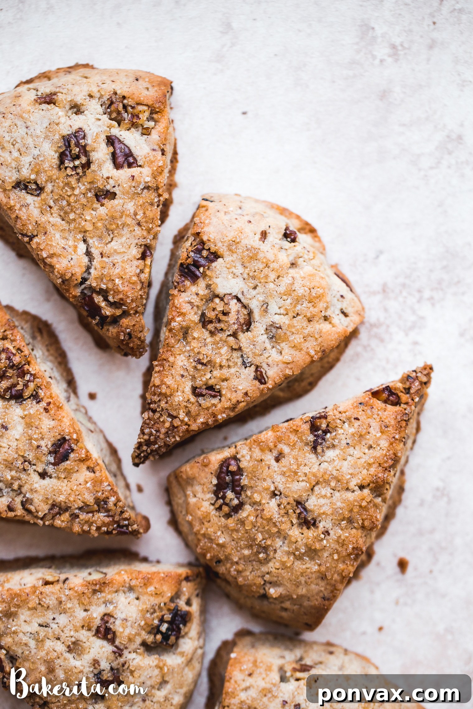 Deliciously Gluten-Free Vegan Maple Pecan Scones 4 A stack of golden Gluten-Free Vegan Maple Pecan Scones, showcasing their inviting texture and generous pecan pieces.