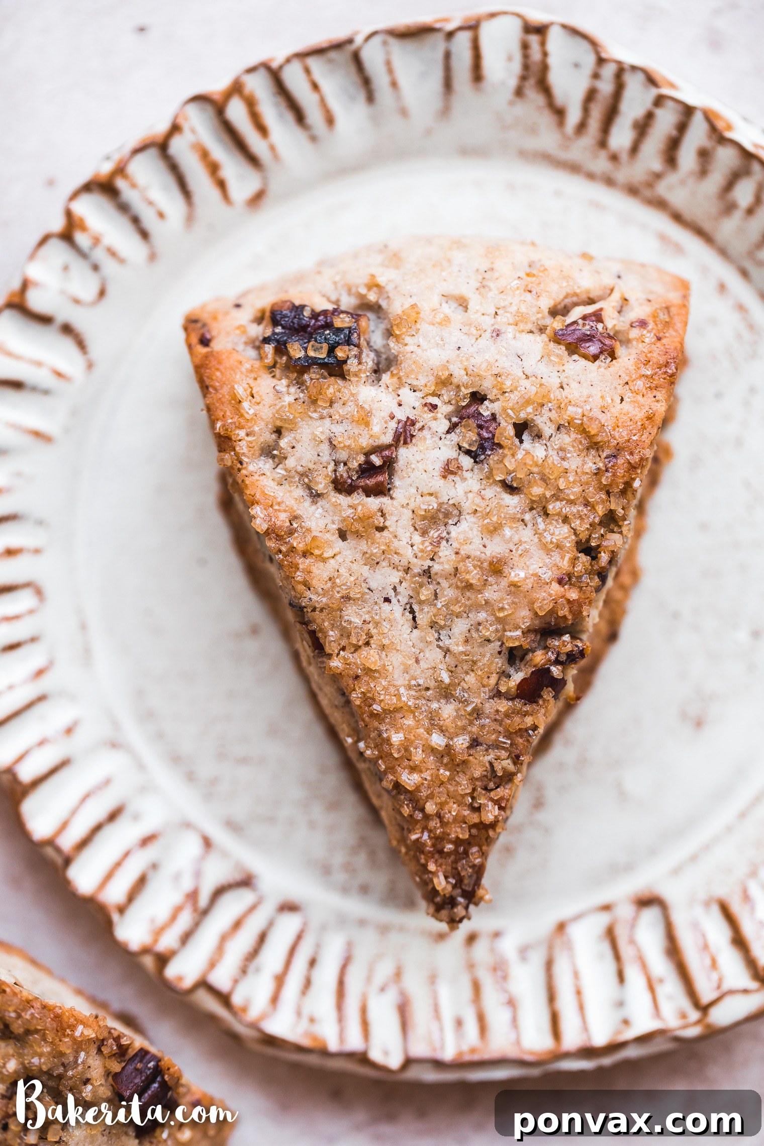 Deliciously Gluten-Free Vegan Maple Pecan Scones 6 A close-up of a Gluten-Free Vegan Maple Pecan Scone split open, revealing its fluffy interior and the warmth of a fresh bake.