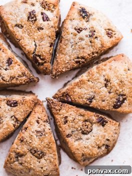 Gluten-Free Vegan Maple Pecan Scones, tender on the inside with a crunchy, golden crust, perfect for any meal.