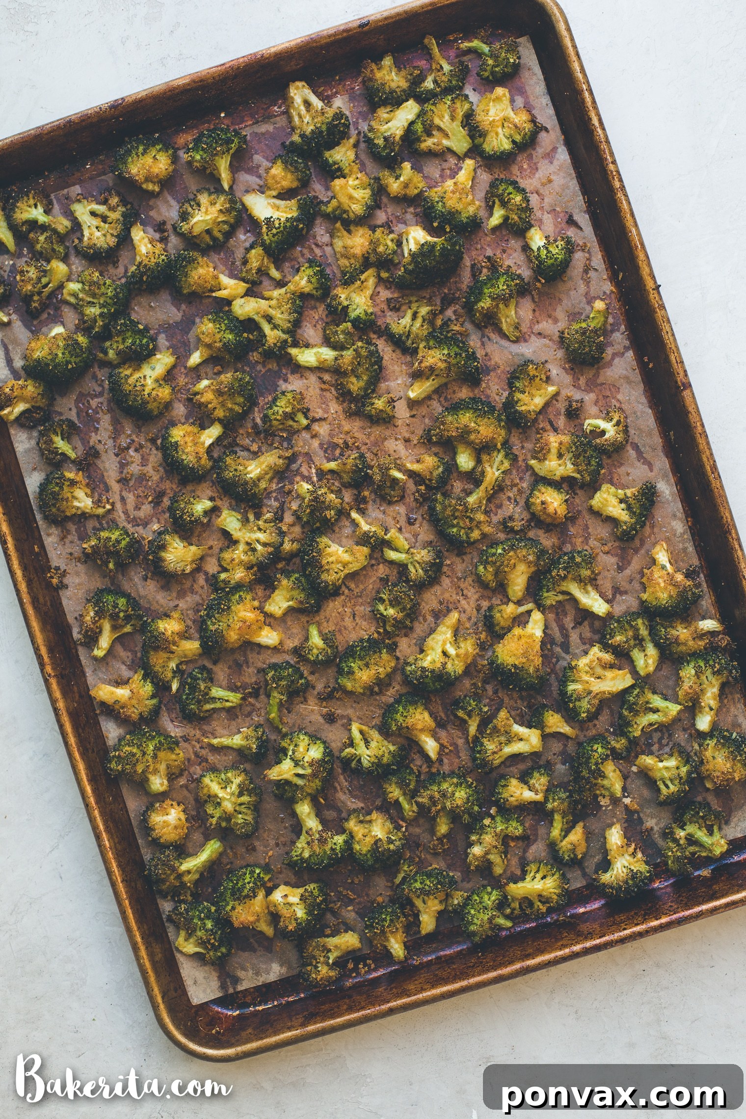 Fresh lemon wedges and zest ready to be added to roasted broccoli.