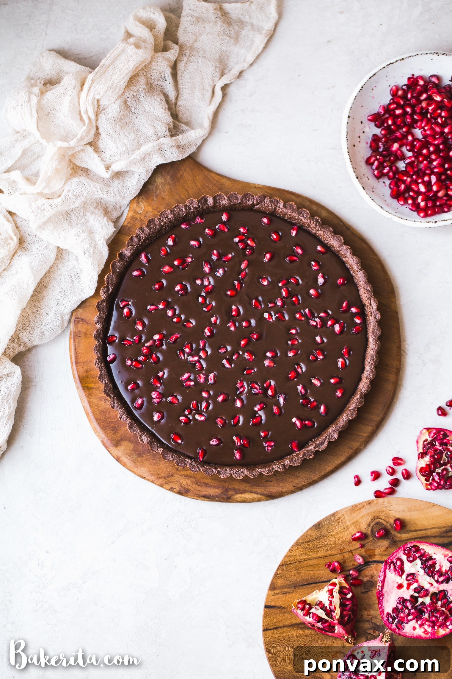 This No-Bake Chocolate Pomegranate Tart is made with 8 simple ingredients and is perfect for holiday entertaining! No baking required for this gluten-free, paleo, and vegan tart.