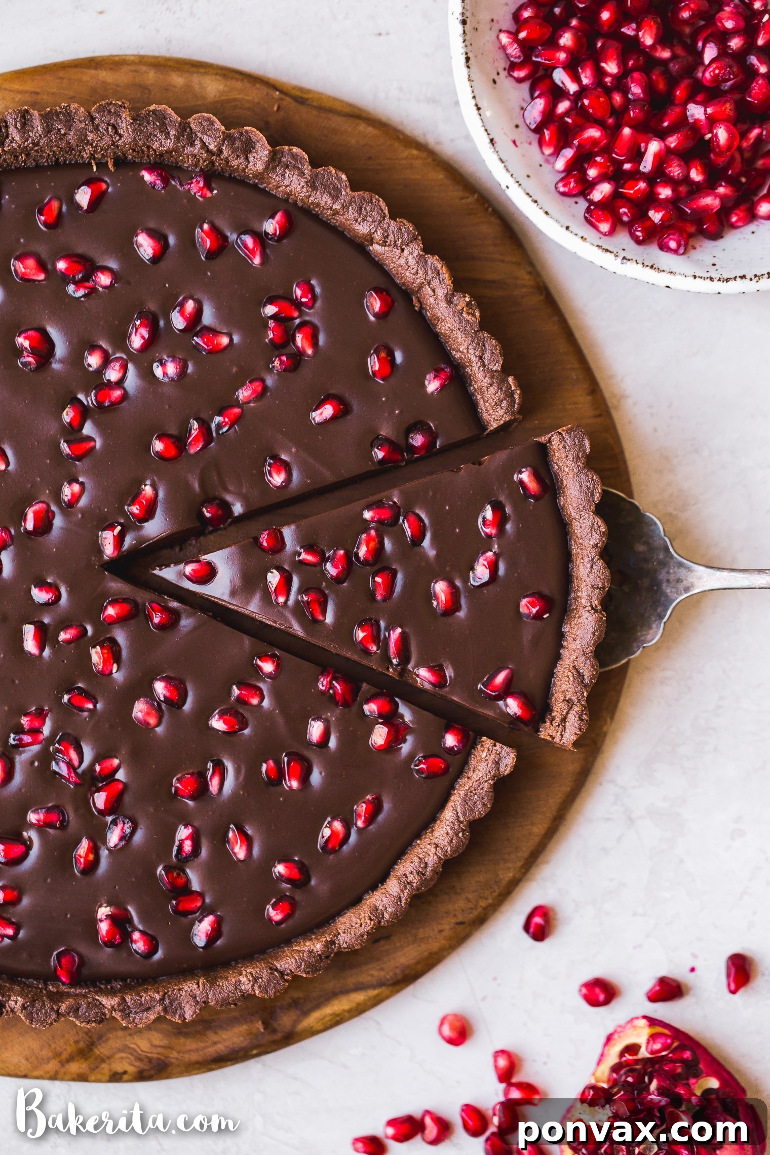 This No-Bake Chocolate Pomegranate Tart is made with 8 simple ingredients and is perfect for holiday entertaining! No baking required for this gluten-free, paleo, and vegan tart.