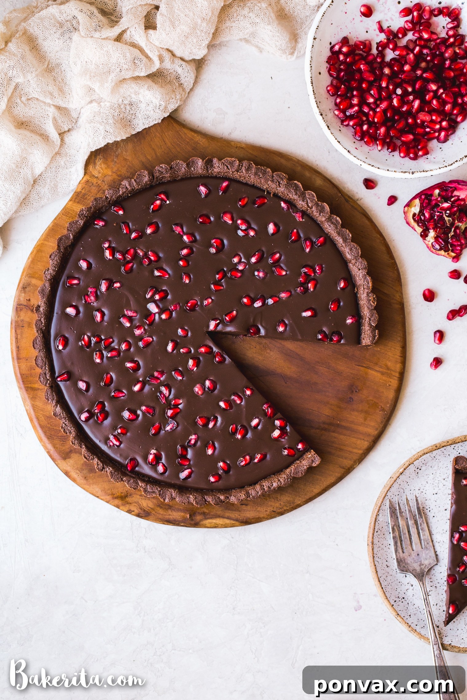 This No-Bake Chocolate Pomegranate Tart is made with 8 simple ingredients and is perfect for holiday entertaining! No baking required for this gluten-free, paleo, and vegan tart.