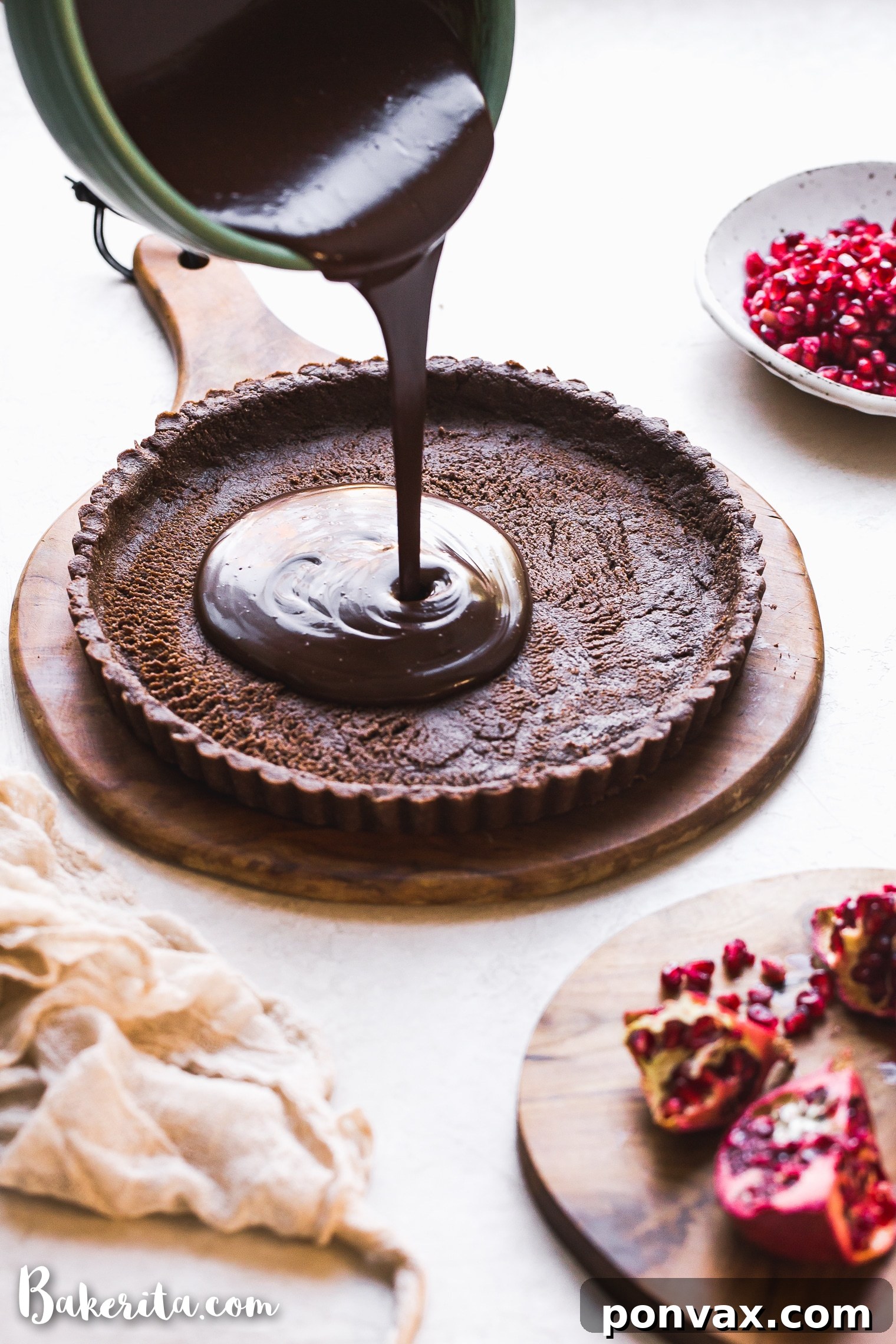 This No-Bake Chocolate Pomegranate Tart is made with 8 simple ingredients and is perfect for holiday entertaining! No baking required for this gluten-free, paleo, and vegan tart.