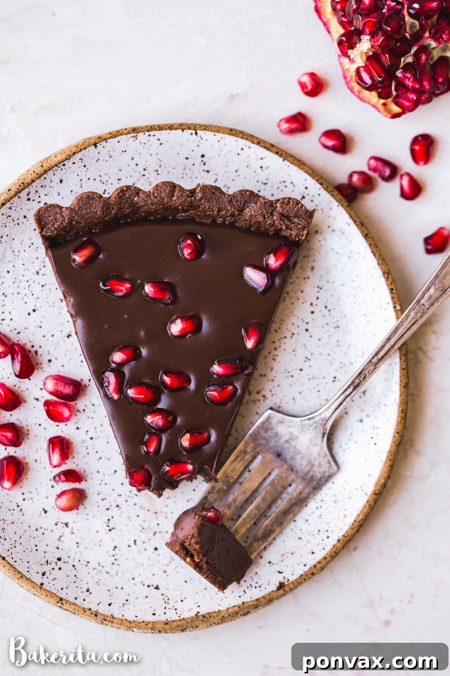 This No-Bake Chocolate Pomegranate Tart is made with 8 simple ingredients and is perfect for holiday entertaining! No baking required for this gluten-free, paleo and vegan tart.