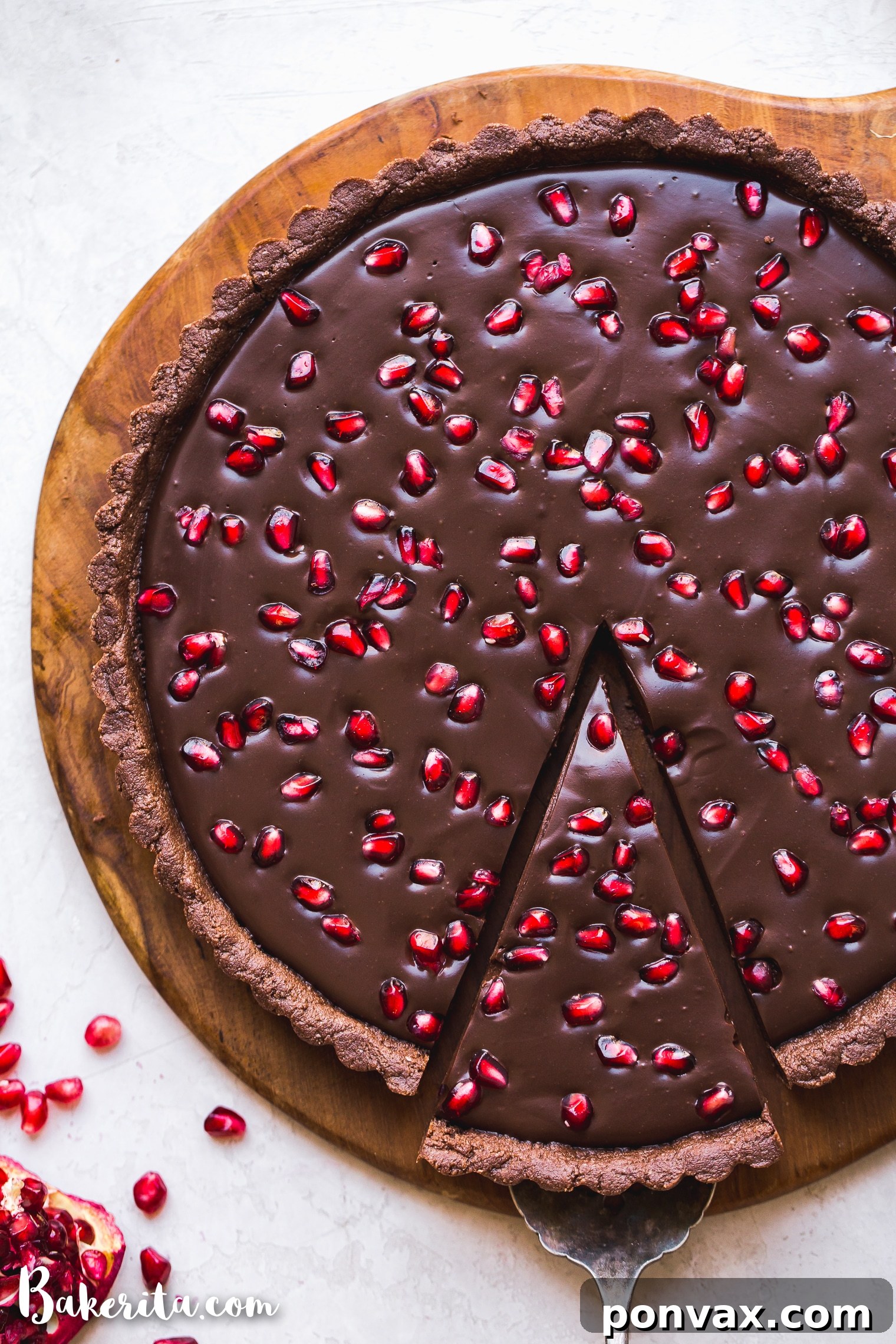 This No-Bake Chocolate Pomegranate Tart is made with 8 simple ingredients and is perfect for holiday entertaining! No baking required for this gluten-free, paleo, and vegan tart.