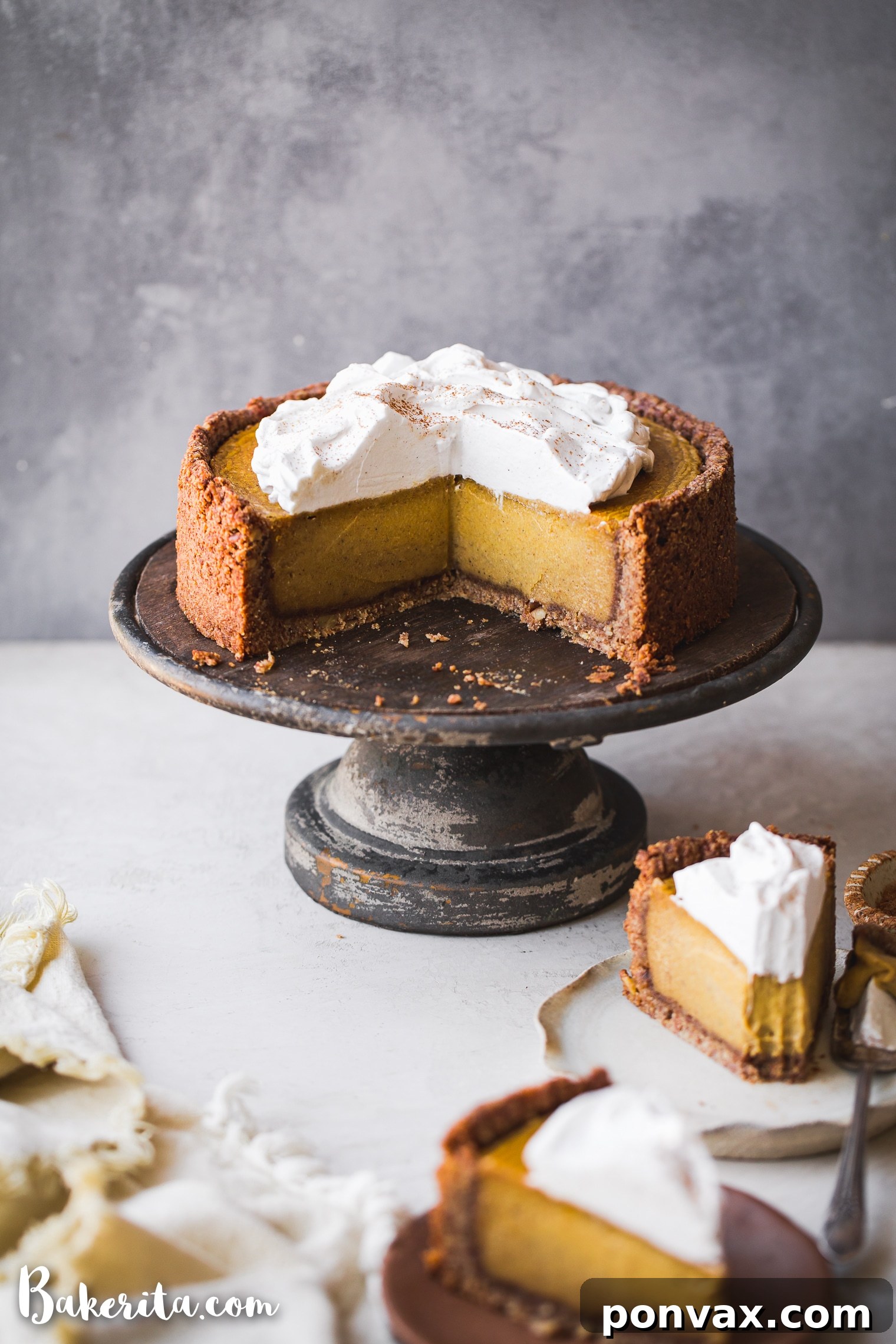 Autumn Glow Vegan Gluten-Free Pumpkin Cheesecake 2 A beautifully sliced Baked Vegan Pumpkin Cheesecake, showcasing its creamy texture and golden-brown crust. Perfect for Thanksgiving dessert.