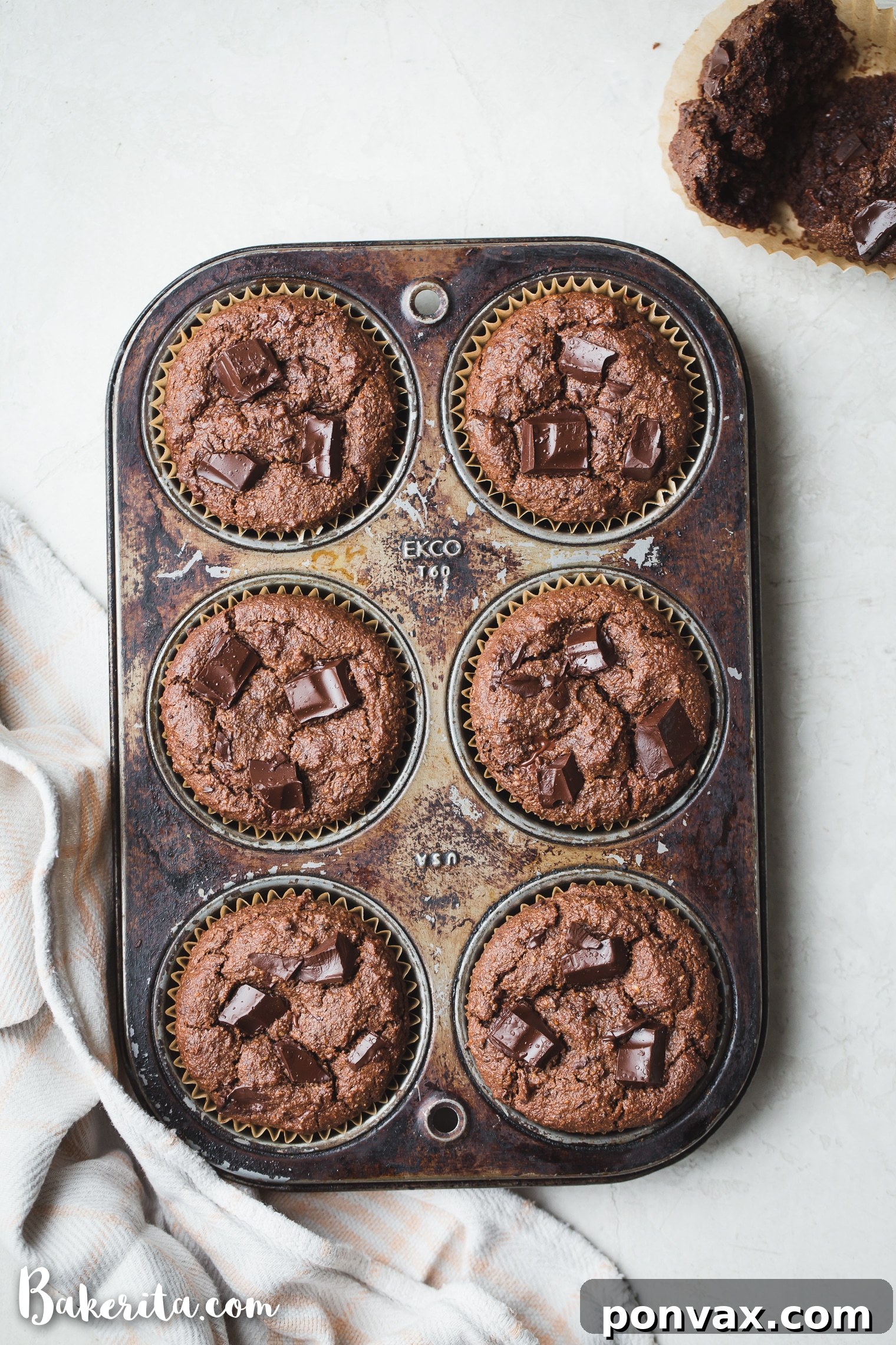 Decadent Gluten-Free Vegan Double Chocolate Muffins 7 Close-up of a Gluten-Free Vegan Double Chocolate Muffin, showcasing its moist interior and generous chocolate chunks.