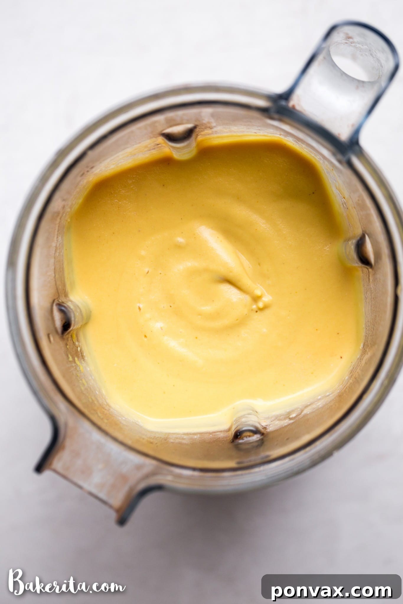 A bowl of healthy and easy vegan cheese sauce, perfect for mac and cheese, nachos, or dipping vegetables.