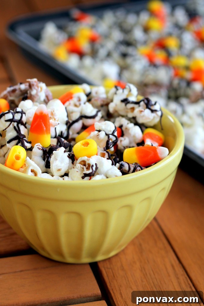 White Chocolate Candy Corn Popcorn for Halloween This White Chocolate Candy Corn Popcorn is tossed with pretzels, candy corn, white chocolate, and a drizzle of dark chocolate for a Halloween treat!