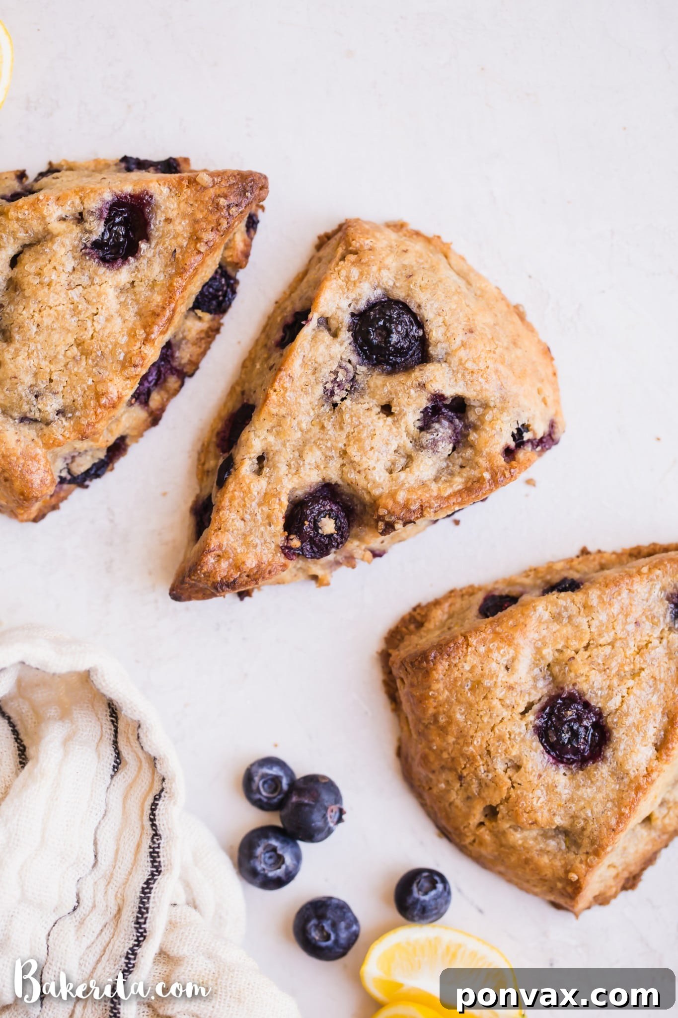 A beautifully arranged plate of freshly baked gluten-free vegan lemon blueberry scones, ready to be served for breakfast or a snack.