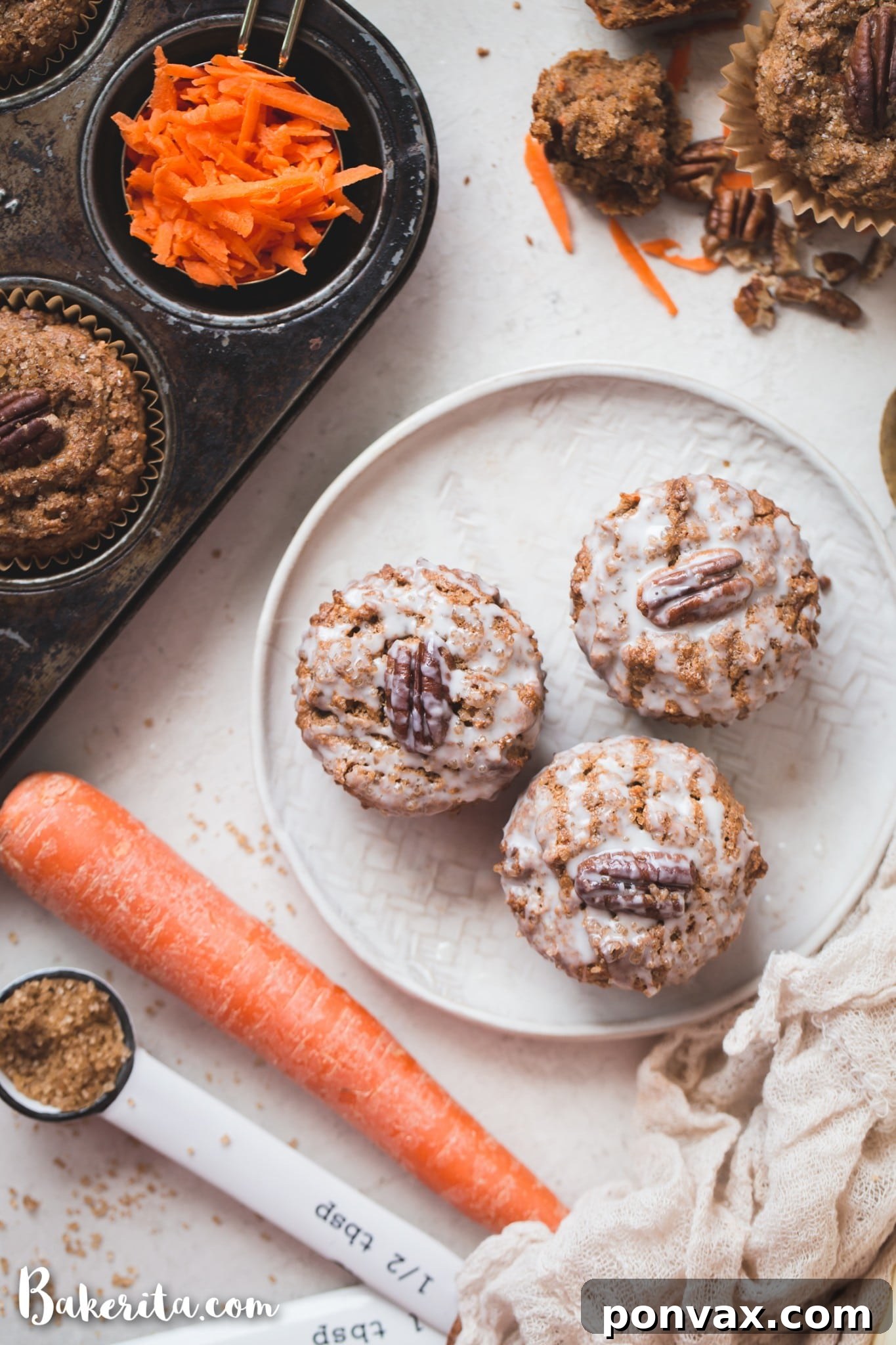 Perfectly Spiced Gluten-Free Vegan Carrot Cake Muffins 4 A warm batch of Gluten-Free Vegan Carrot Cake Muffins, fresh from the oven, resting in a muffin tin, their golden domes inviting a bite.