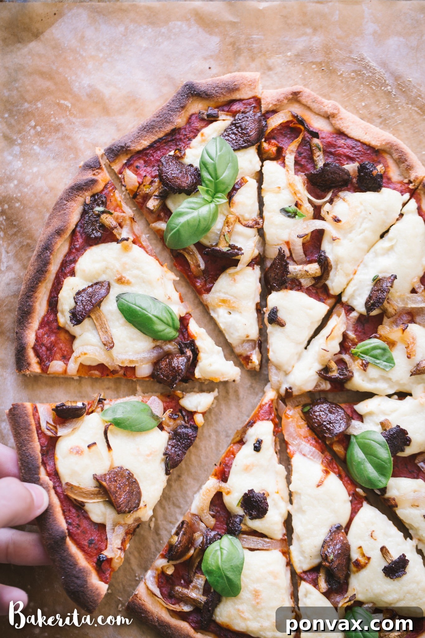 Close-up shot of a freshly baked Gluten-Free Vegan Pizza featuring golden-brown crust, melted vegan mozzarella, sautéed mushrooms, and caramelized onions.