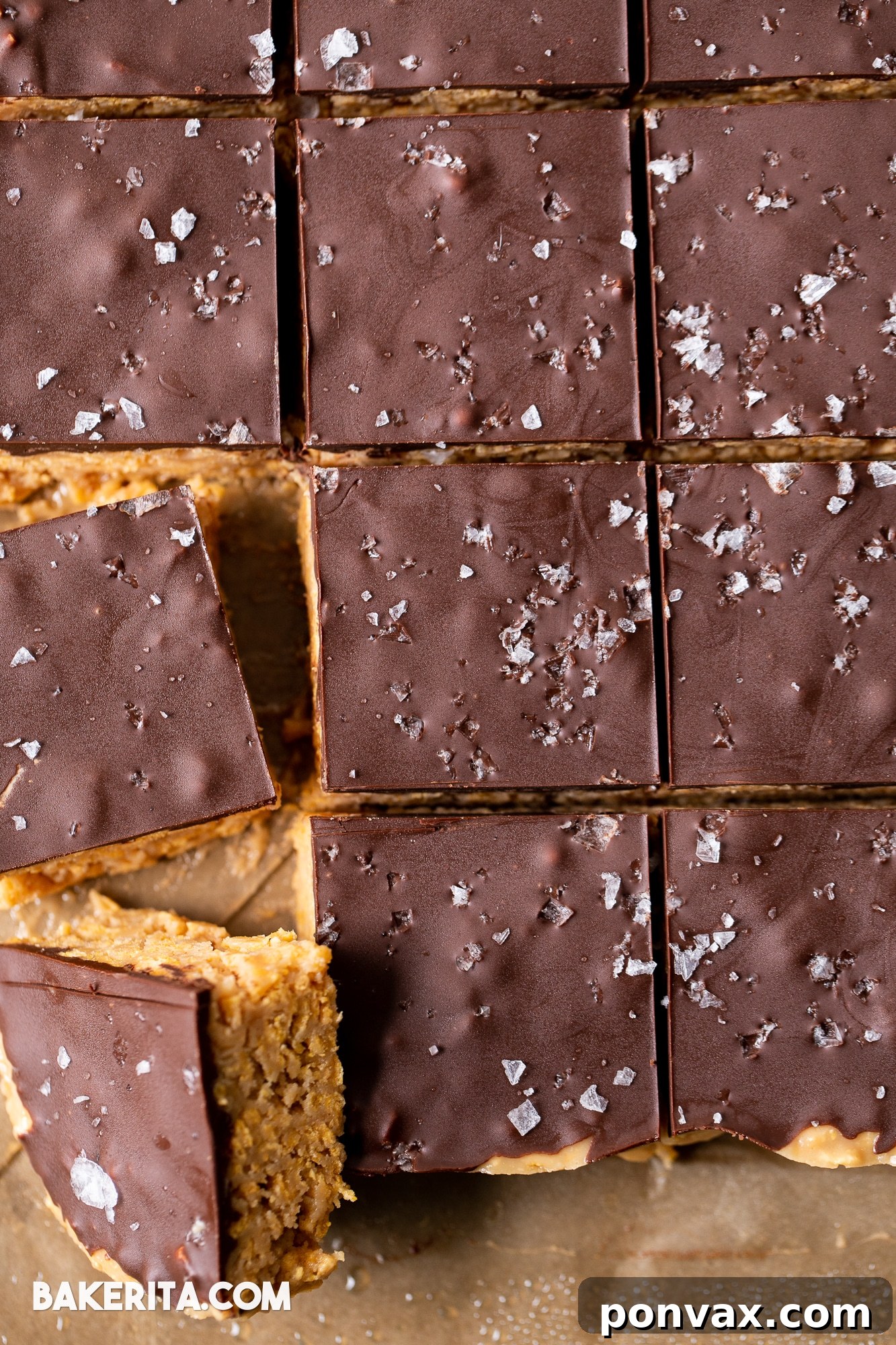 Assortment of peanut butter cornflake bars on a wooden board, showcasing their rich texture and easy preparation.
