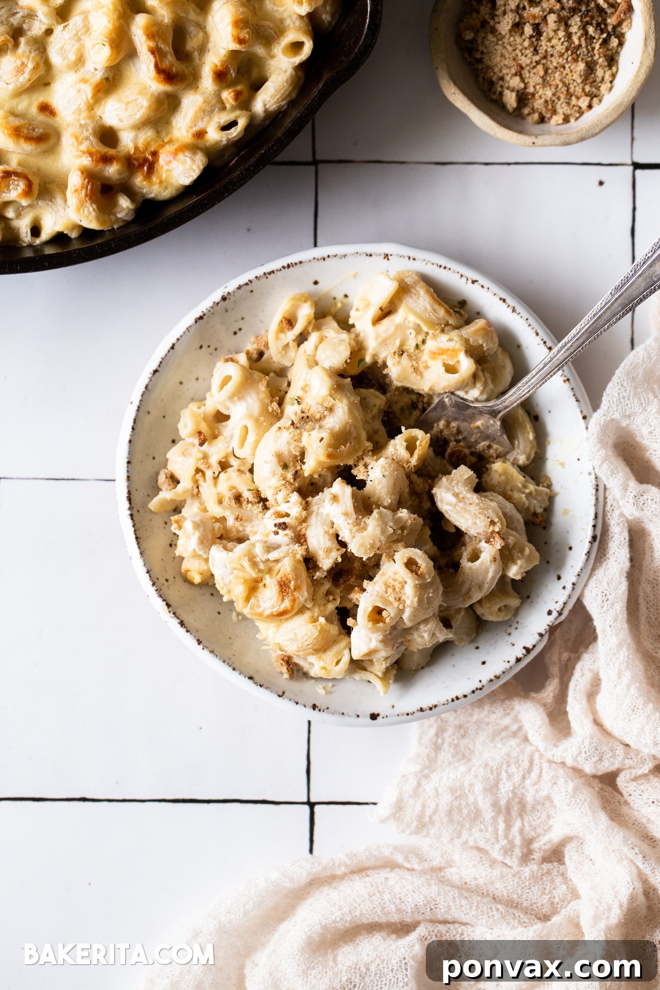 A close-up shot of the raw ingredients, including cashews, chopped onions, and garlic, ready to be transformed into the rich vegan cheese sauce.