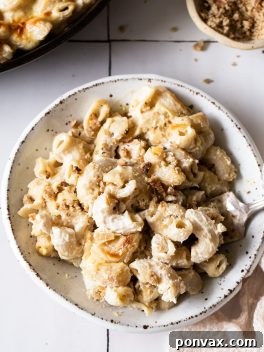 A simple yet satisfying bowl of vegan mac and cheese, perfectly baked with a golden crust, ready to be served.