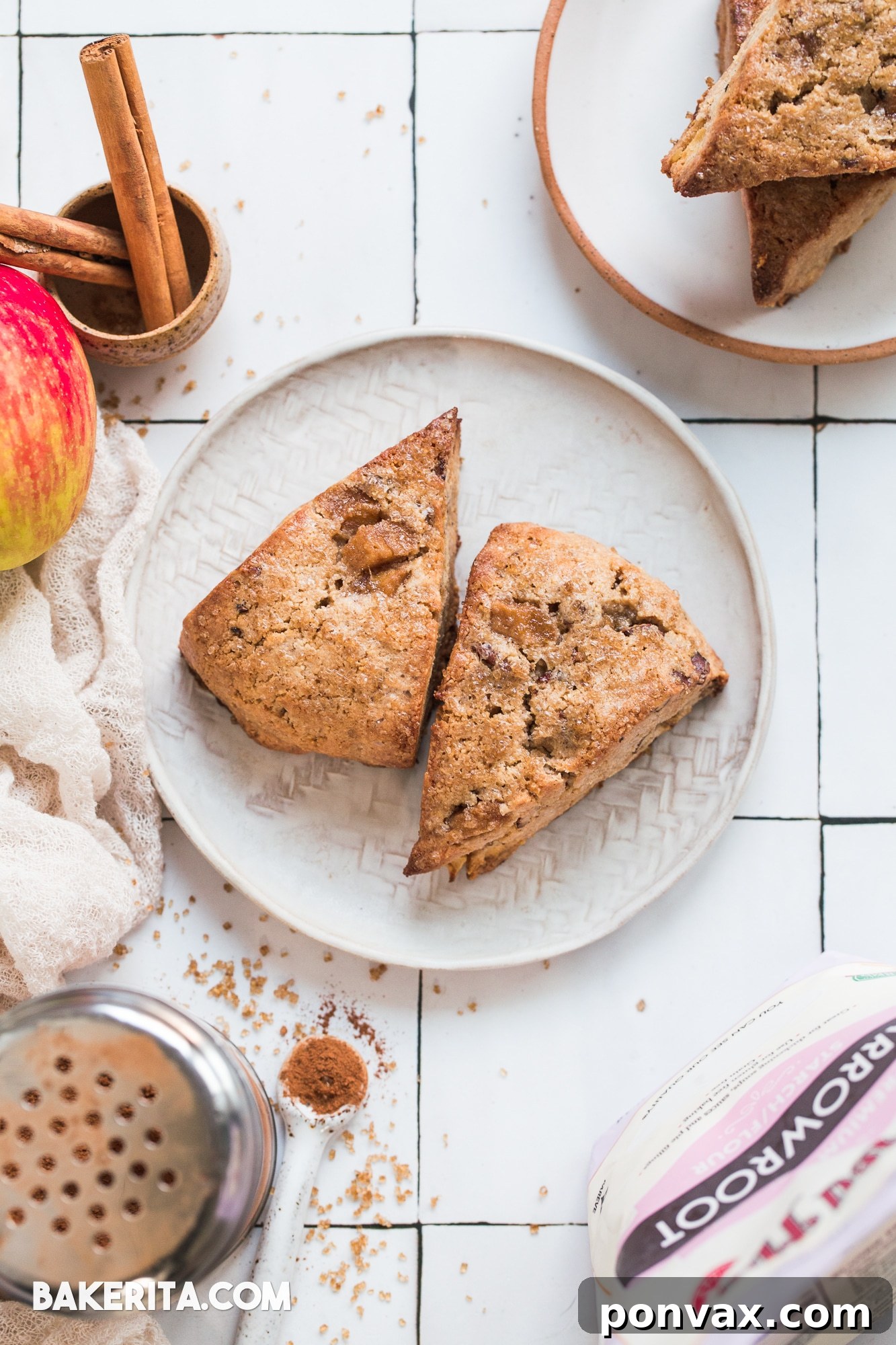 Ingredients for Gluten-Free Vegan Apple Cinnamon Scones laid out, highlighting Bob's Red Mill flours, fresh apple, cinnamon, and pecans.