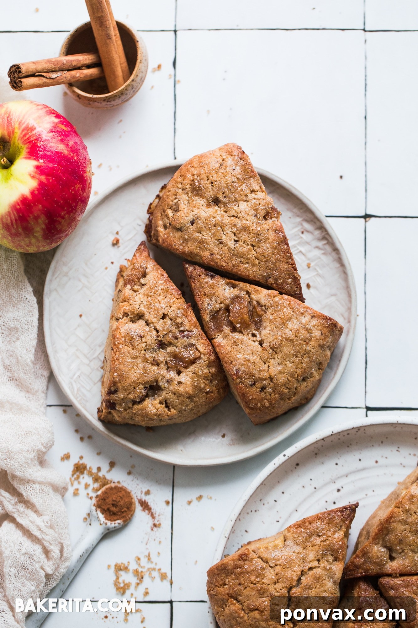 Cold coconut oil being cut into a bowl of dry ingredients for scone dough, demonstrating the technique for flaky texture.