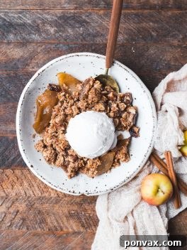 Healthy Gluten-Free Vegan Apple Crisp with a luscious caramel apple filling and oatmeal crumble topping.