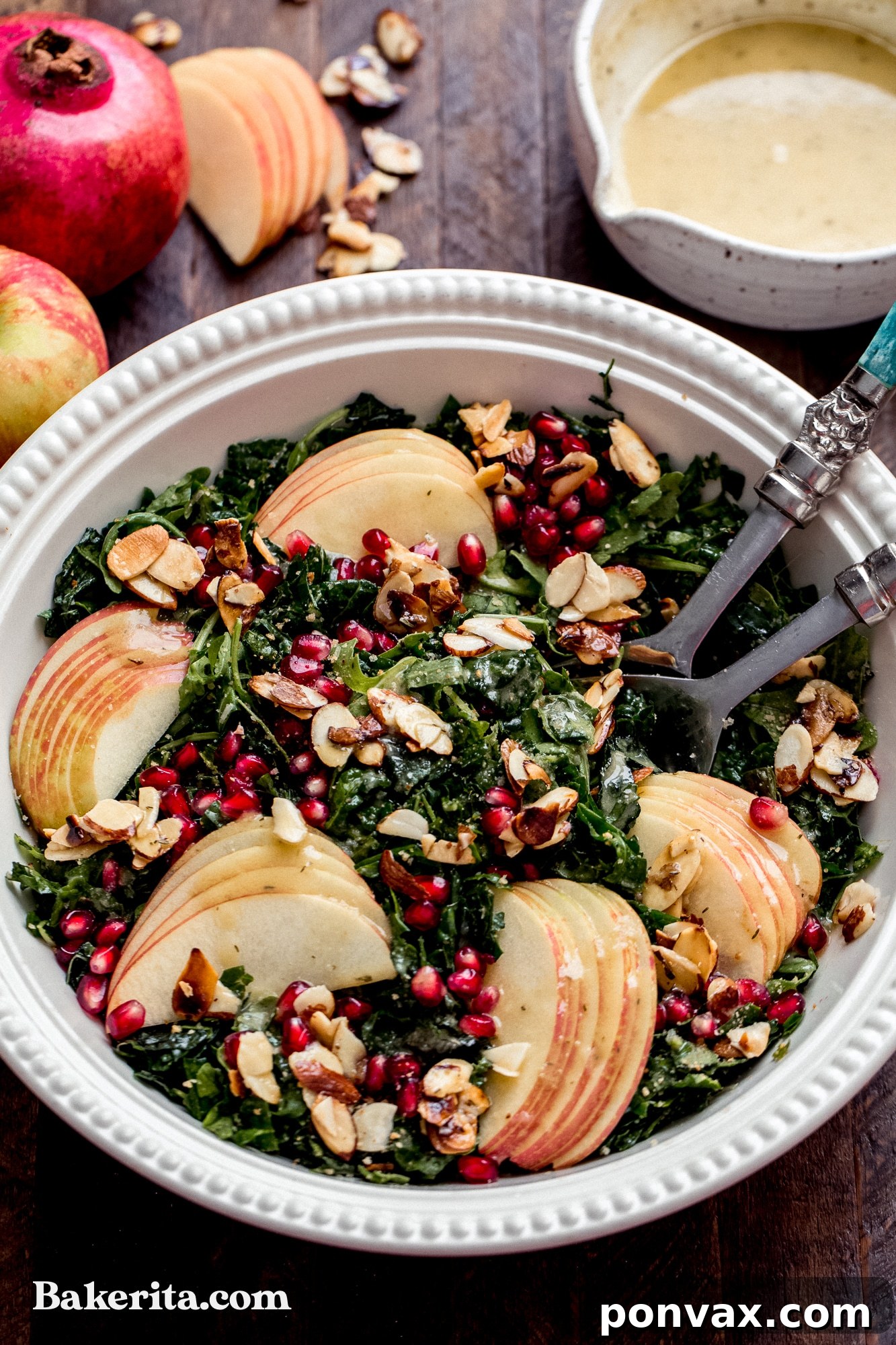 A close-up of a glass jar filled with the homemade Apple Cider Vinaigrette, ready to be shaken and drizzled over the Autumn Kale Harvest Salad.