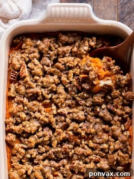 This Vegan Sweet Potato Casserole with Gluten-Free Pecan Crumble recipe is the best sweet potato casserole ever! It's made with fresh yams and coconut sugar for subtle sweetness. With a crispy gluten-free pecan crumble topping, you'll definitely be serving yourself seconds. It's easy to make the day of, or can be prepared in advance for an easy make-ahead holiday side dish.