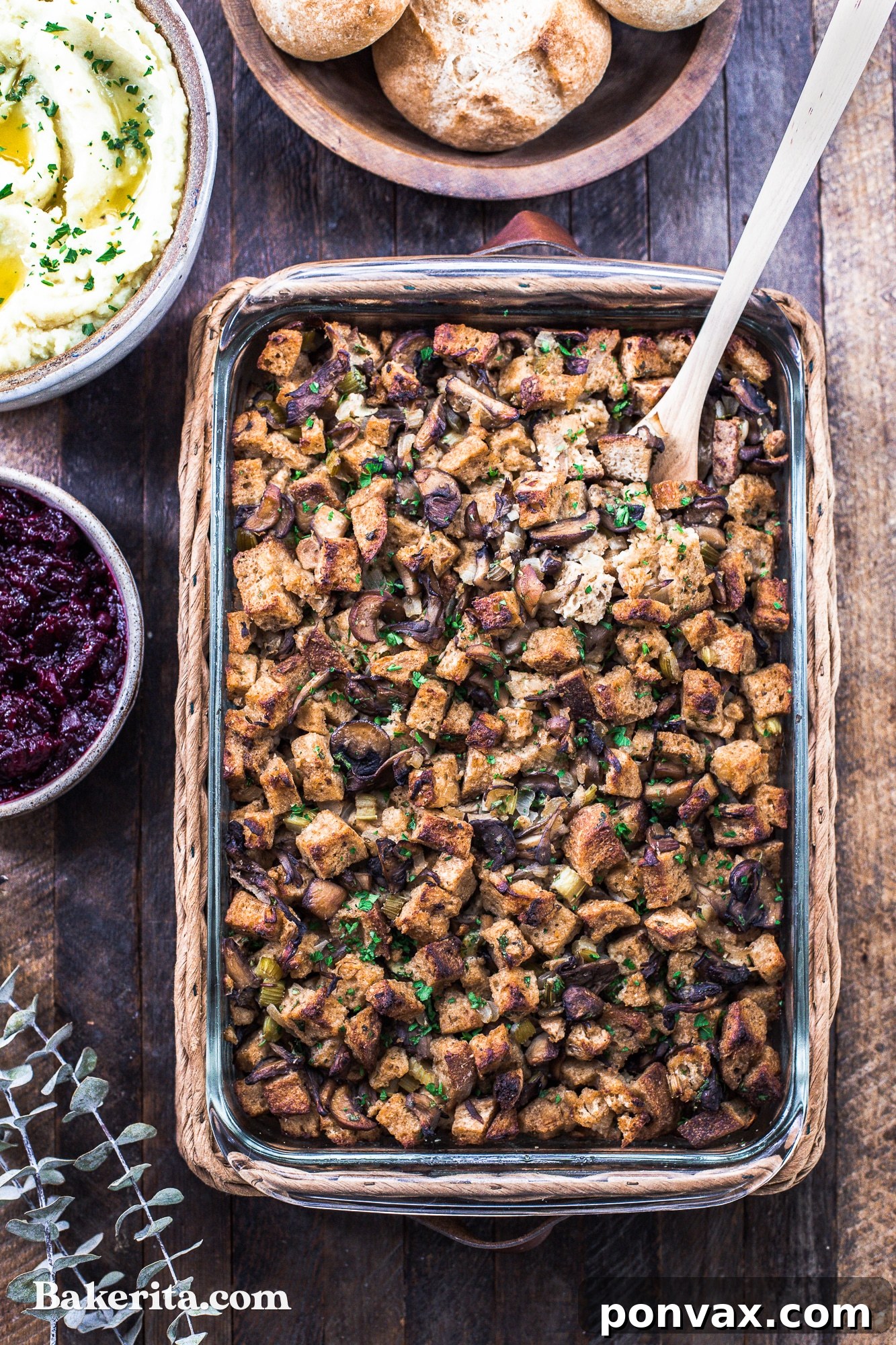 A rustic shot of Vegan Mushroom Stuffing in a baking dish, freshly out of the oven, steam gently rising.