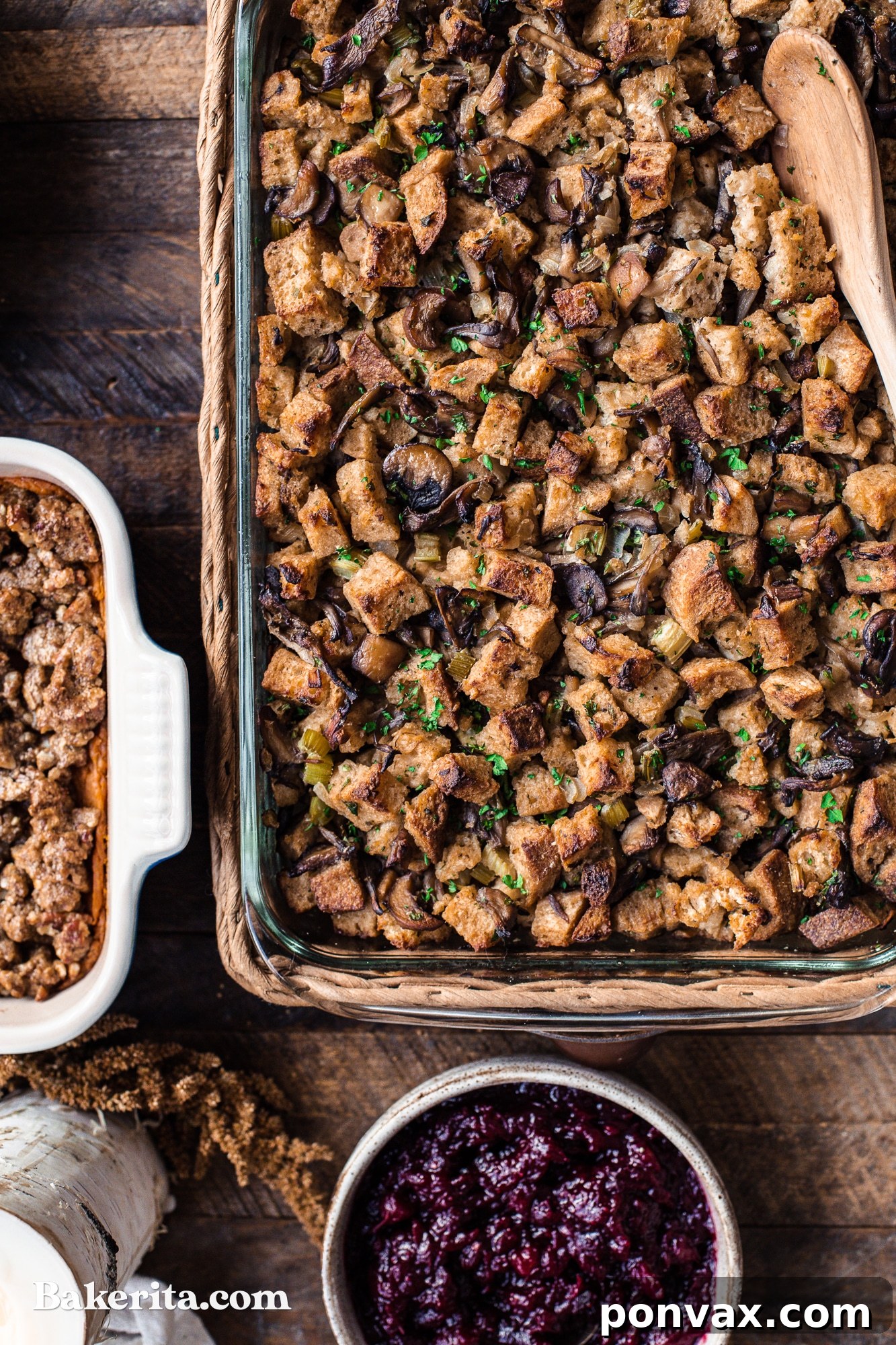 A close-up of a serving of Vegan Mushroom Stuffing, with rich brown gravy generously poured over it.