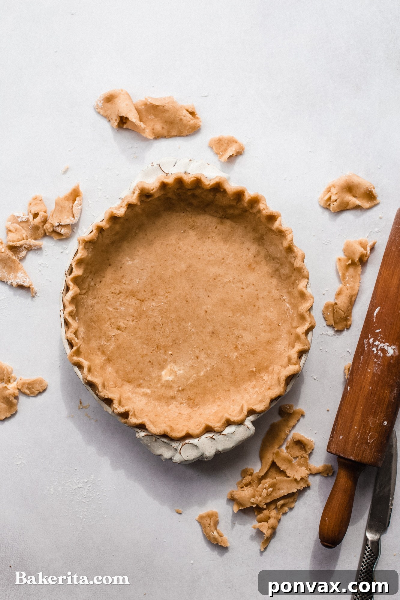A golden brown gluten-free vegan pie crust with a crimped edge, freshly baked and ready for filling.