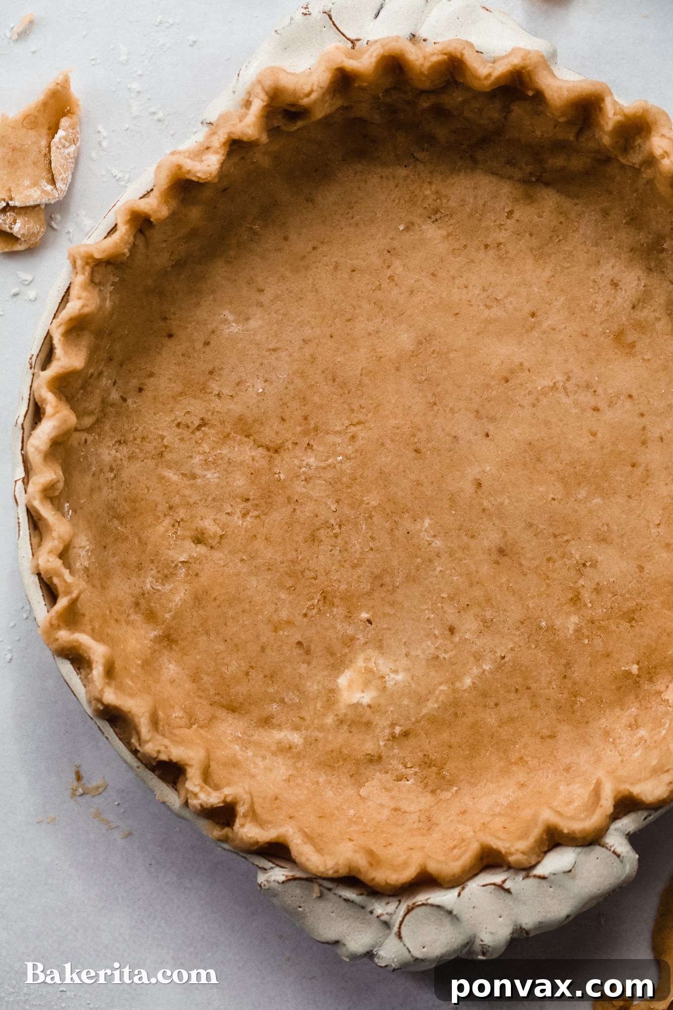A baked gluten-free vegan pie crust, golden and ready to be filled.